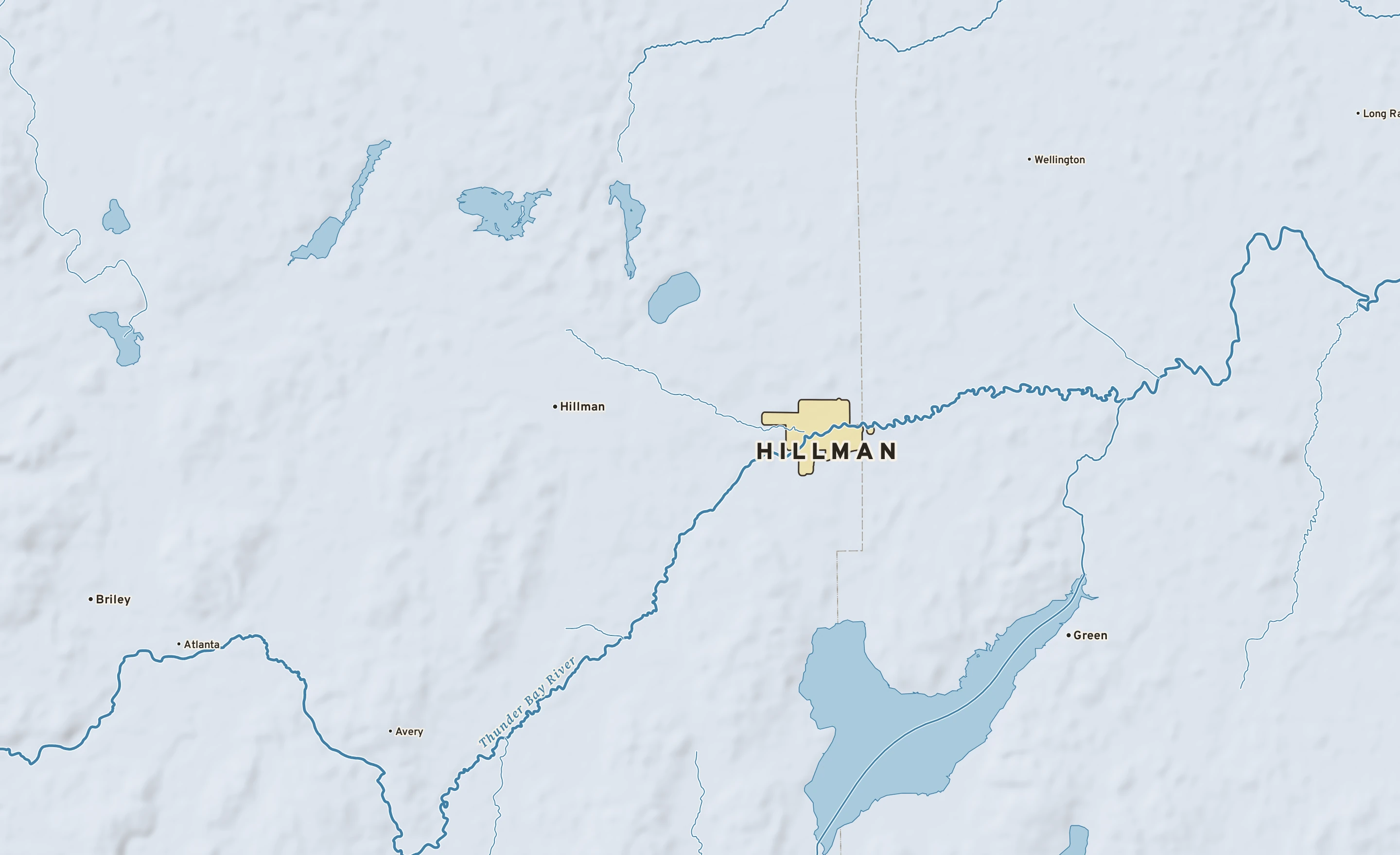 Shaded-relief atlas plate of Hillman, Michigan: rivers, roads, the city limits and where the water drains.
