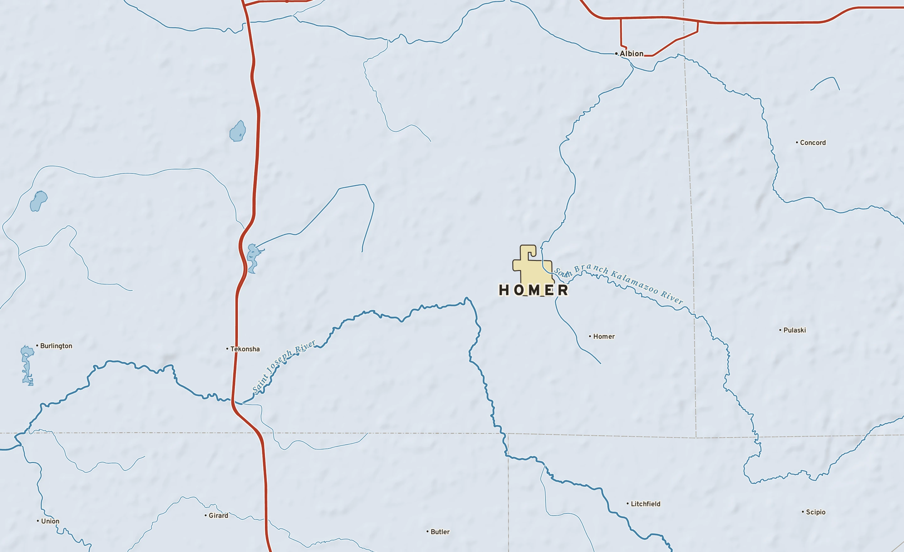 Shaded-relief atlas plate of Homer, Michigan: rivers, roads, the city limits and where the water drains.