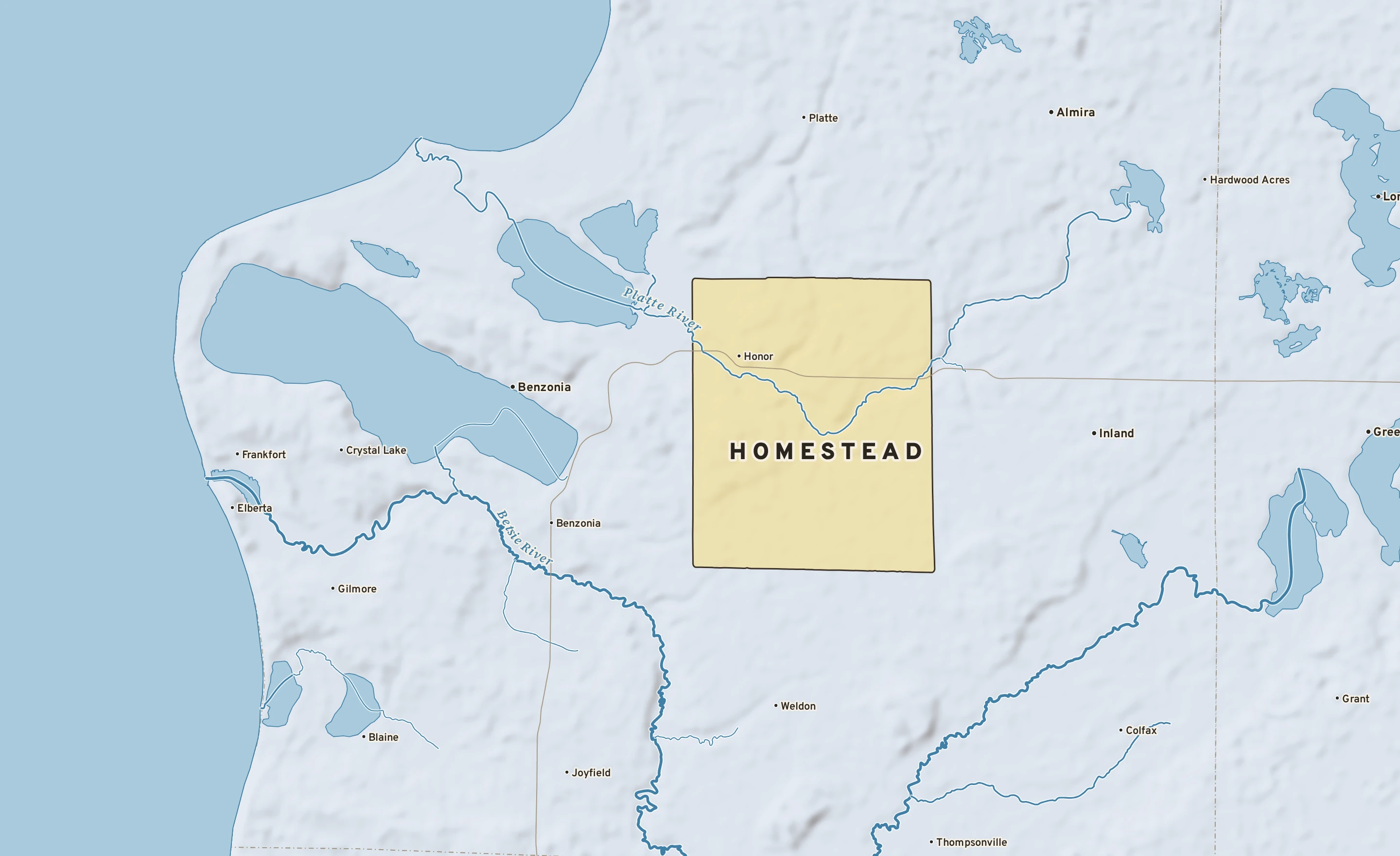 Shaded-relief atlas plate of Homestead, Michigan: rivers, roads, the city limits and where the water drains.