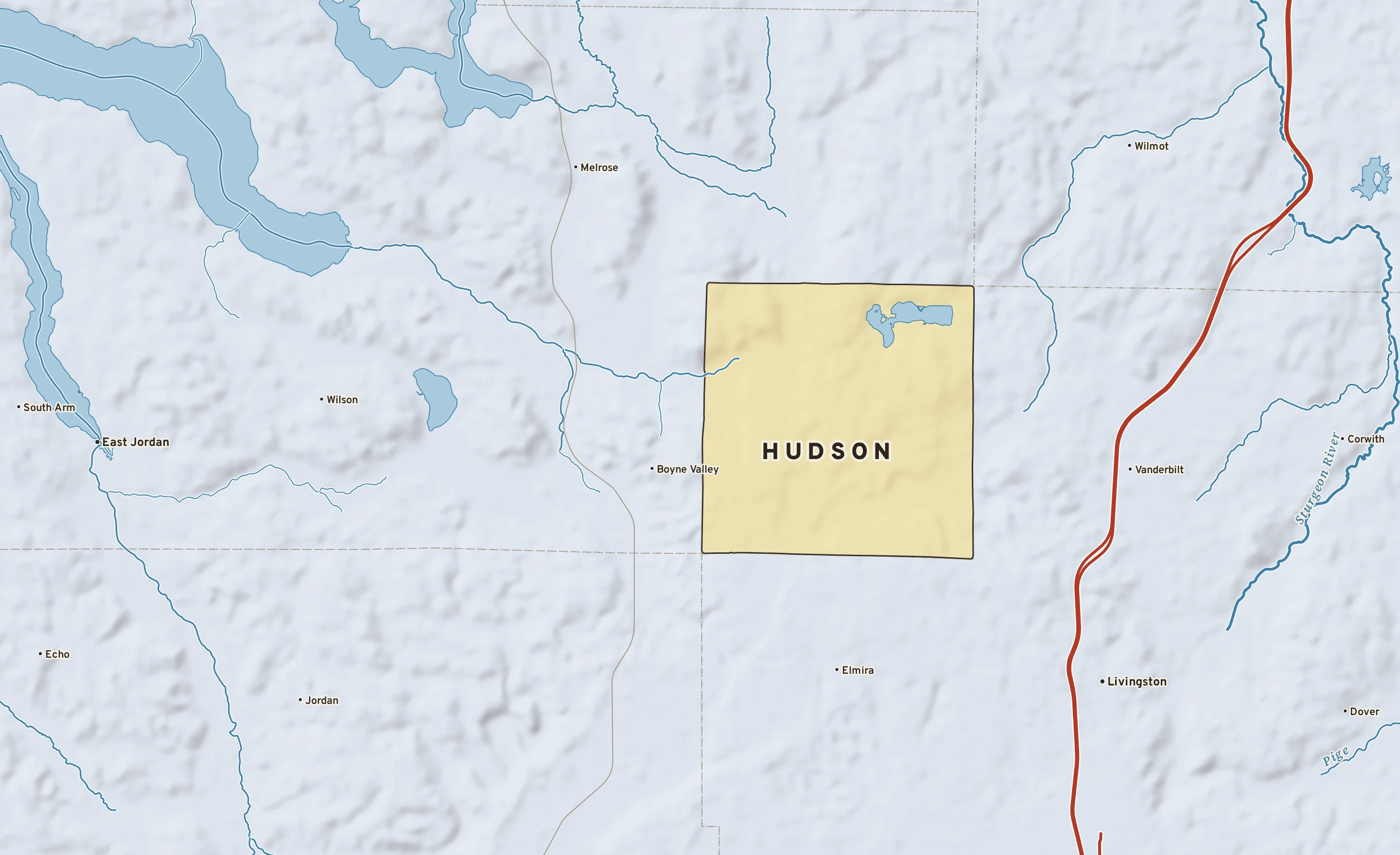Shaded-relief atlas plate of Hudson, Michigan: rivers, roads, the city limits and where the water drains.