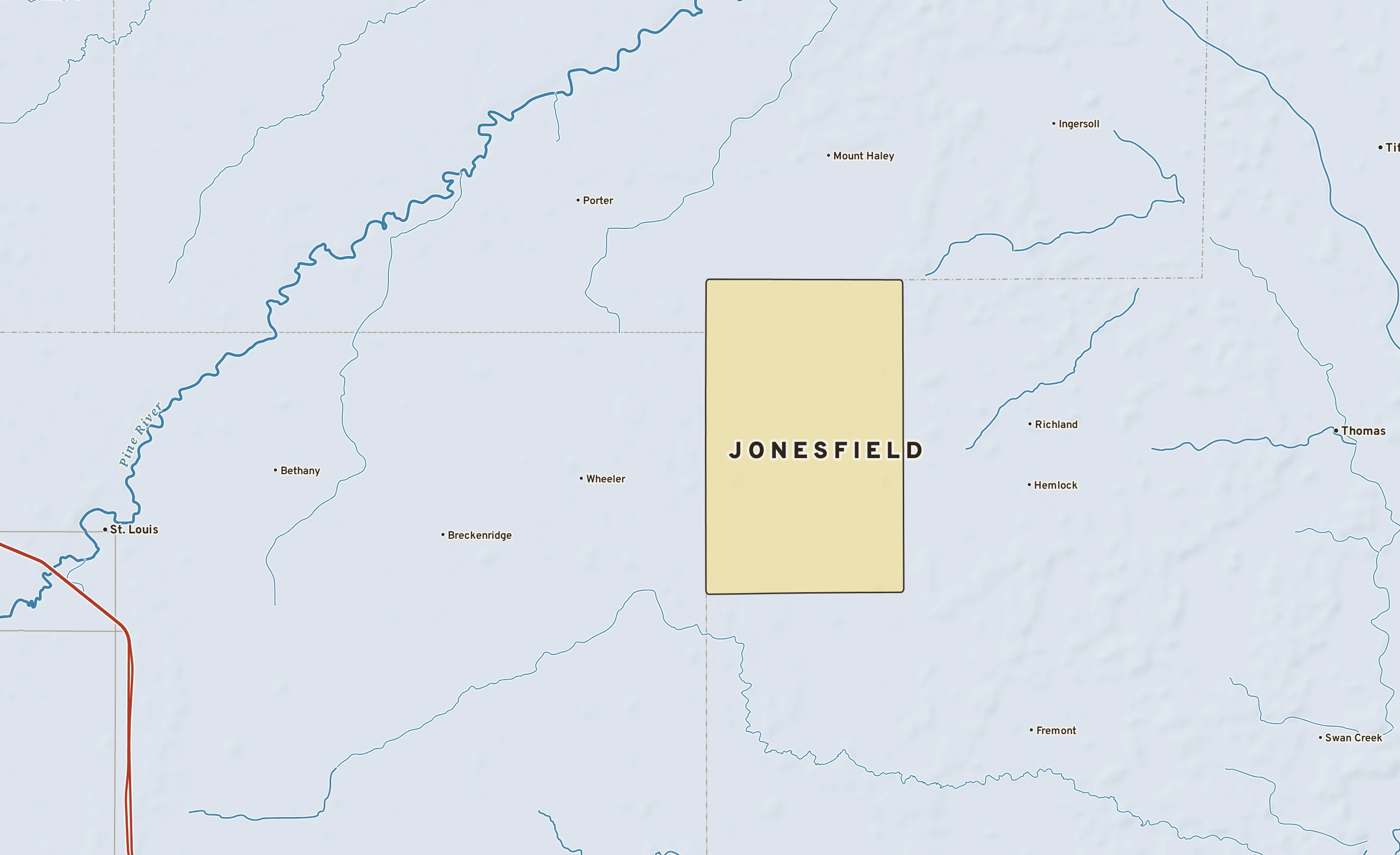 Shaded-relief atlas plate of Jonesfield, Michigan: rivers, roads, the city limits and where the water drains.