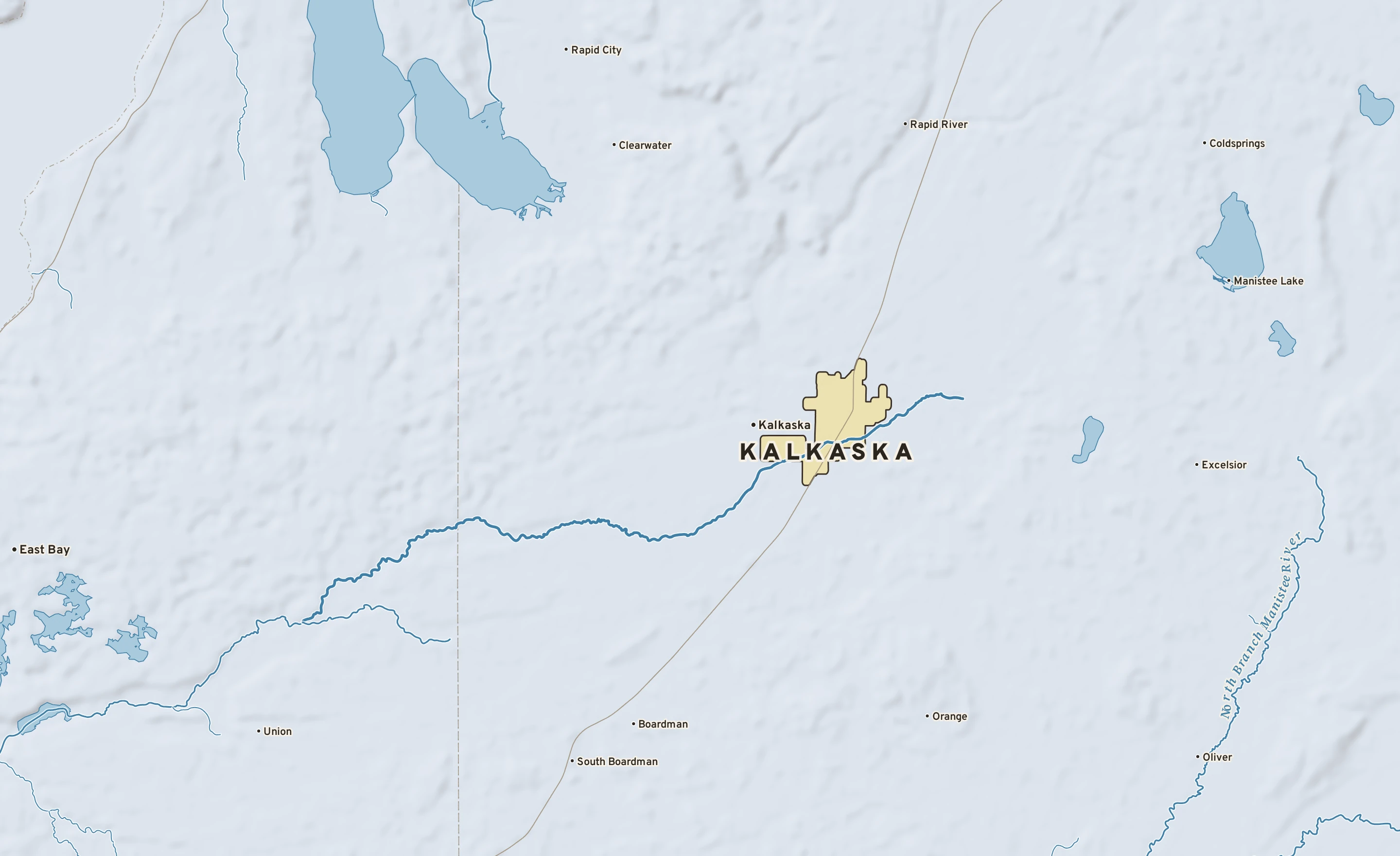 Shaded-relief atlas plate of Kalkaska, Michigan: rivers, roads, the city limits and where the water drains.