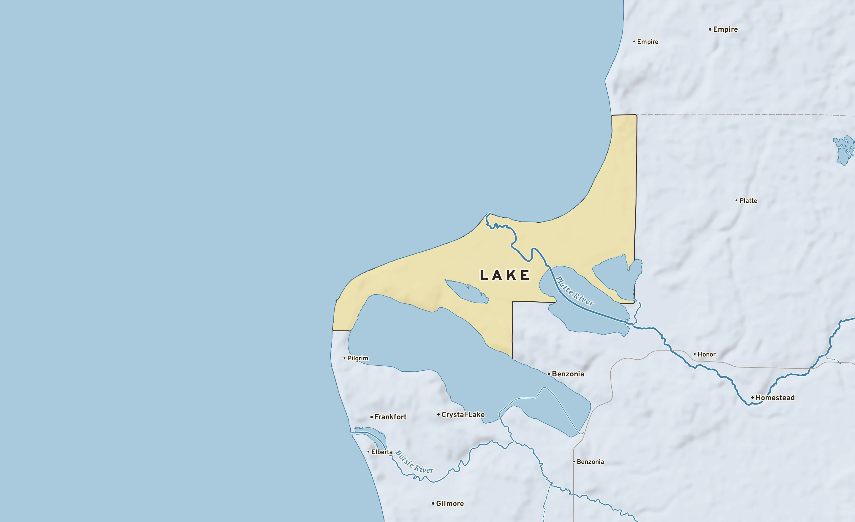 Shaded-relief atlas plate of Lake, Michigan: rivers, roads, the city limits and where the water drains.