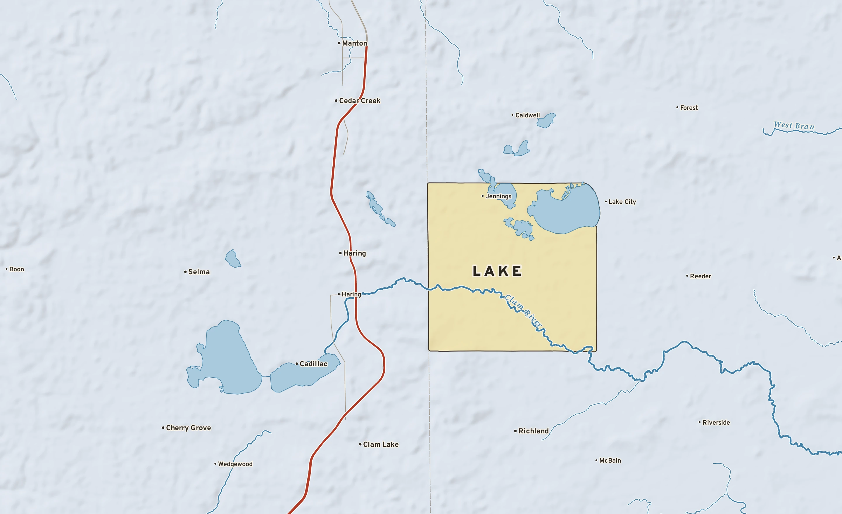 Shaded-relief atlas plate of Lake, Michigan: rivers, roads, the city limits and where the water drains.