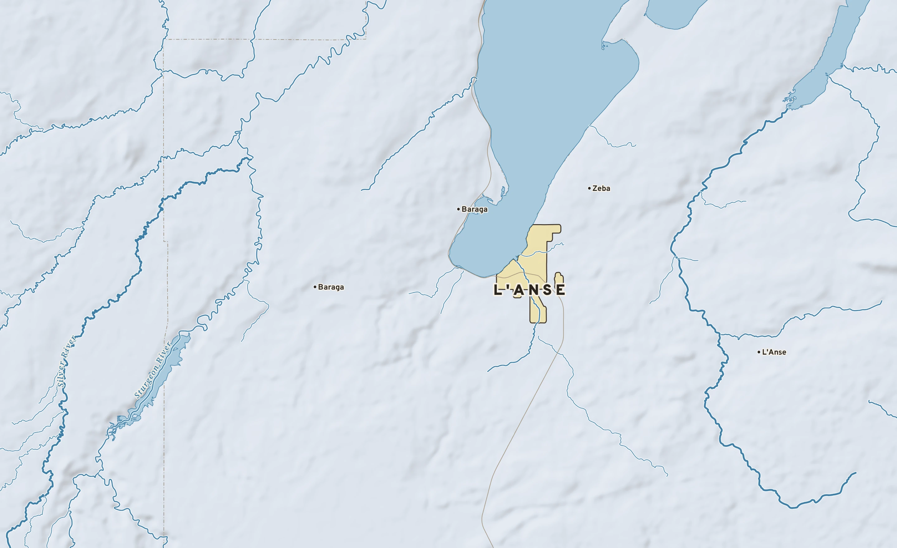 Shaded-relief atlas plate of L'Anse, Michigan: rivers, roads, the city limits and where the water drains.