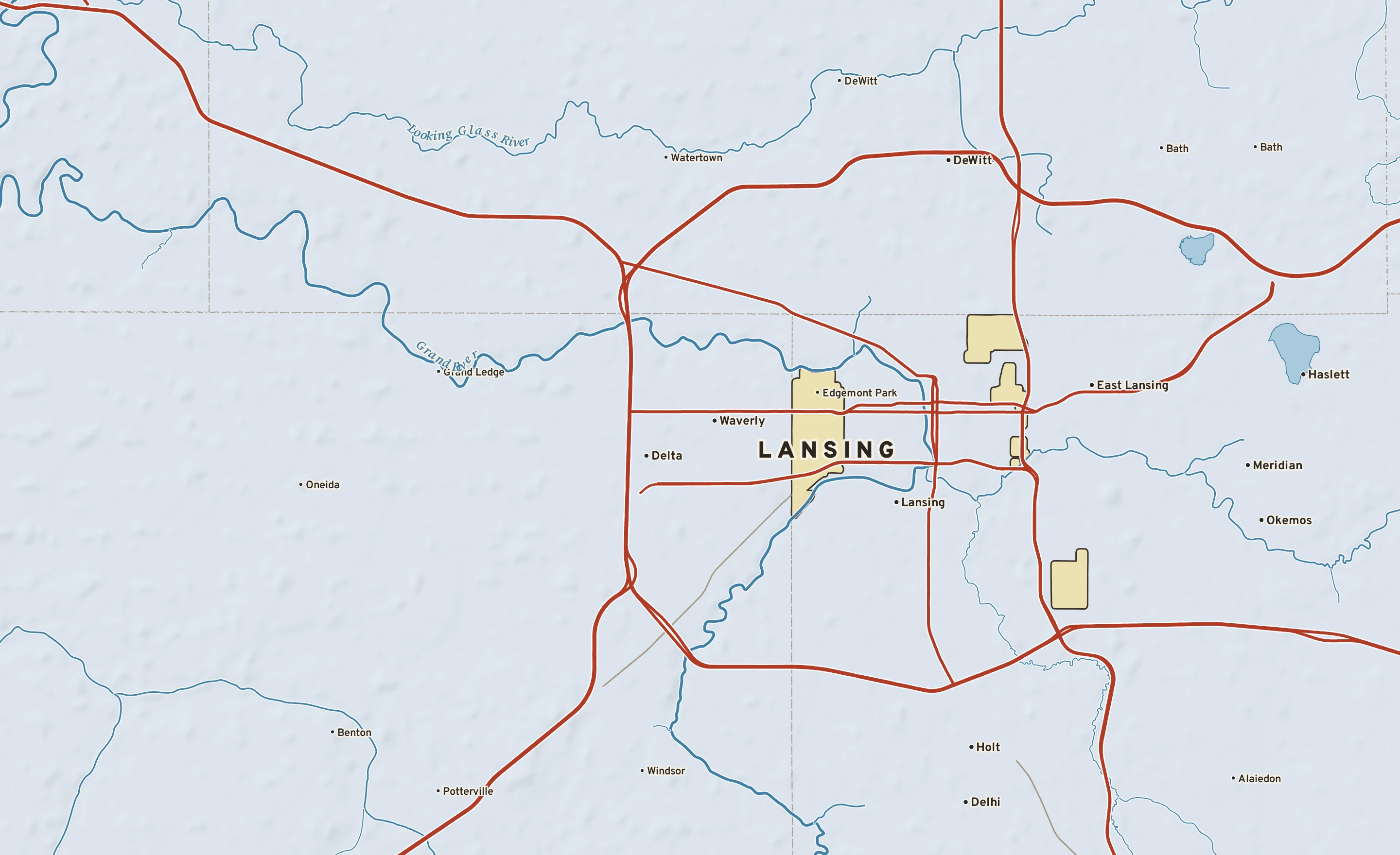 Shaded-relief atlas plate of Lansing, Michigan: rivers, roads, the city limits and where the water drains.