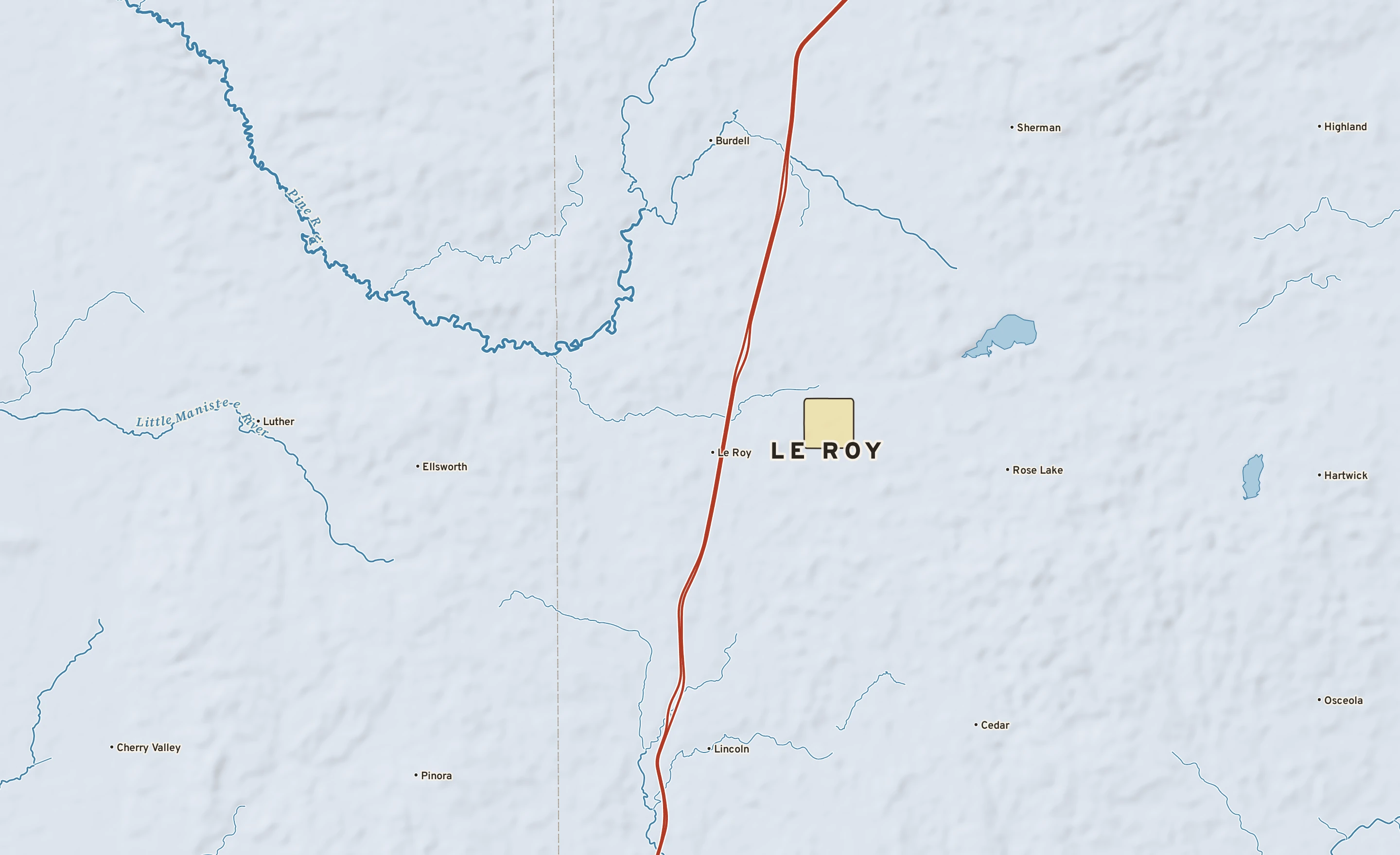 Shaded-relief atlas plate of Le Roy, Michigan: rivers, roads, the city limits and where the water drains.