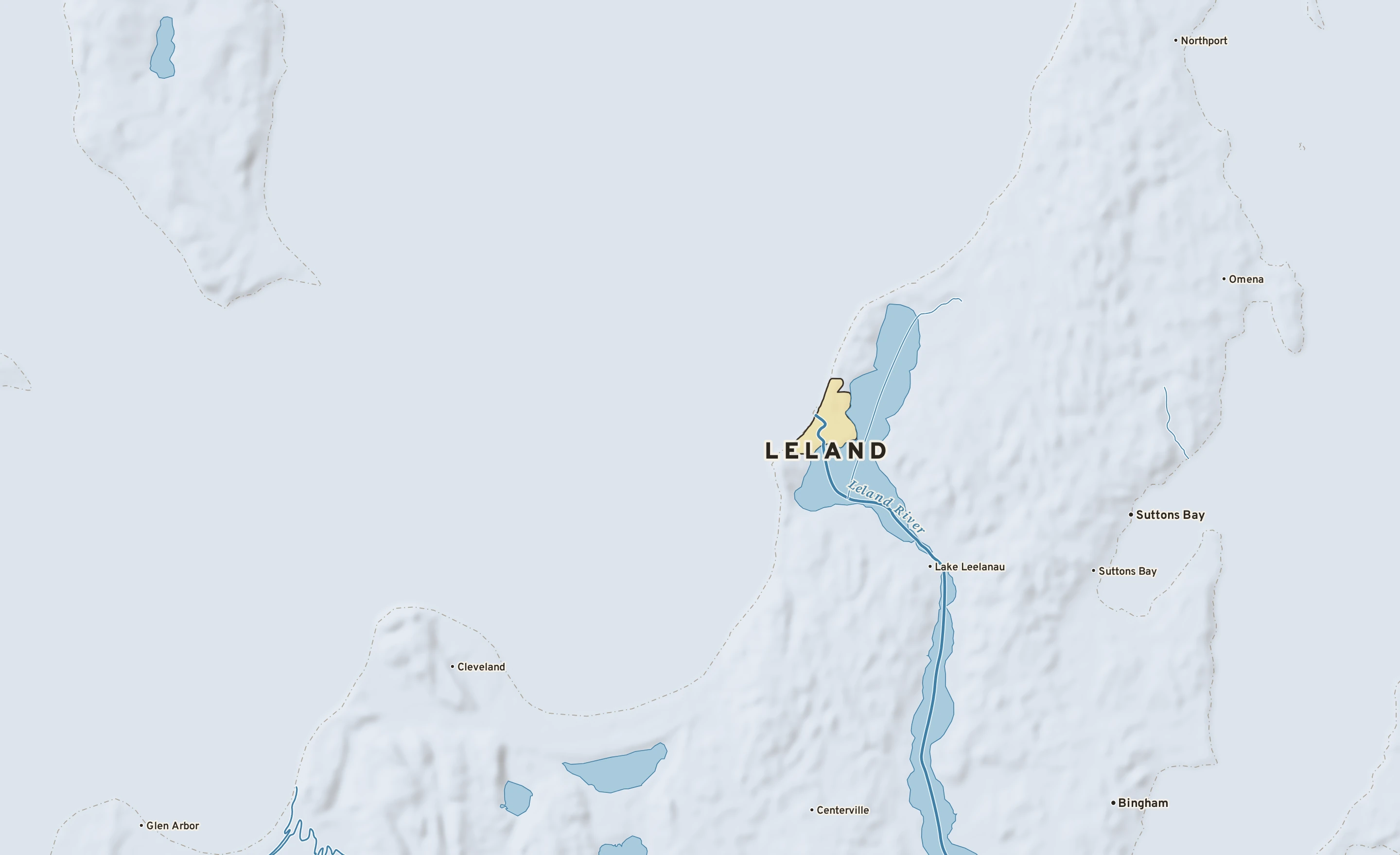 Shaded-relief atlas plate of Leland, Michigan: rivers, roads, the city limits and where the water drains.