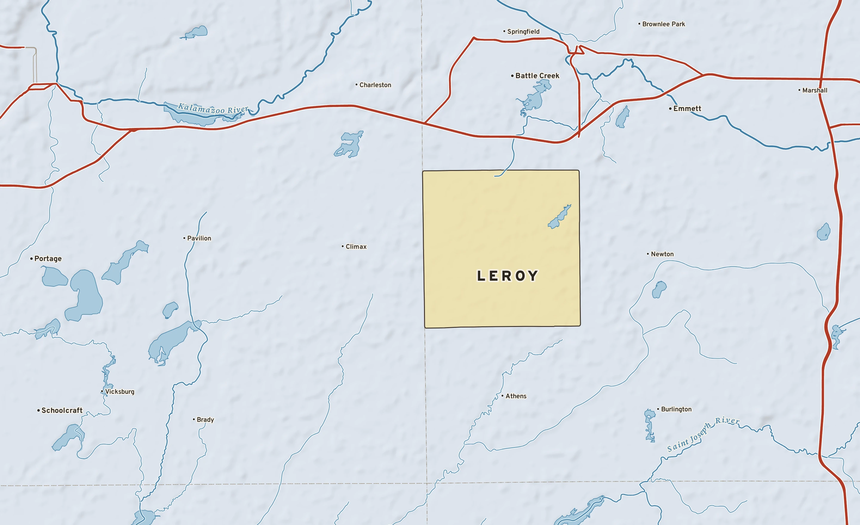 Shaded-relief atlas plate of Leroy, Michigan: rivers, roads, the city limits and where the water drains.