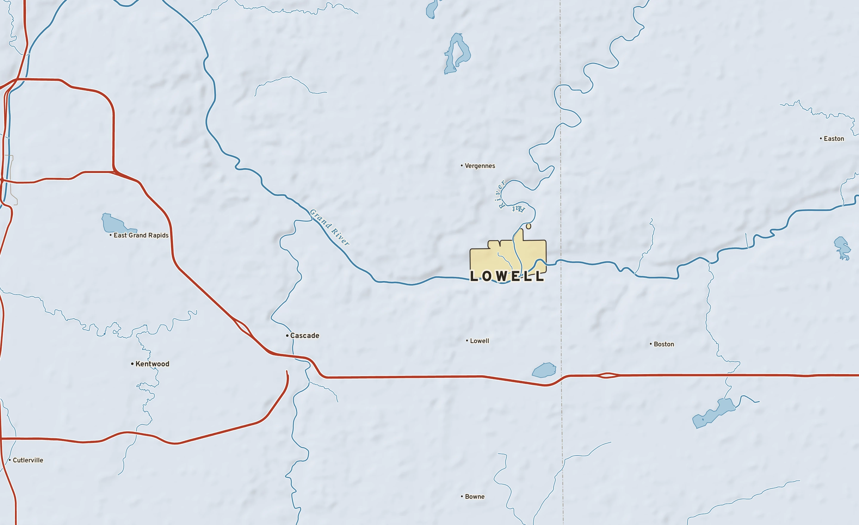 Shaded-relief atlas plate of Lowell, Michigan: rivers, roads, the city limits and where the water drains.