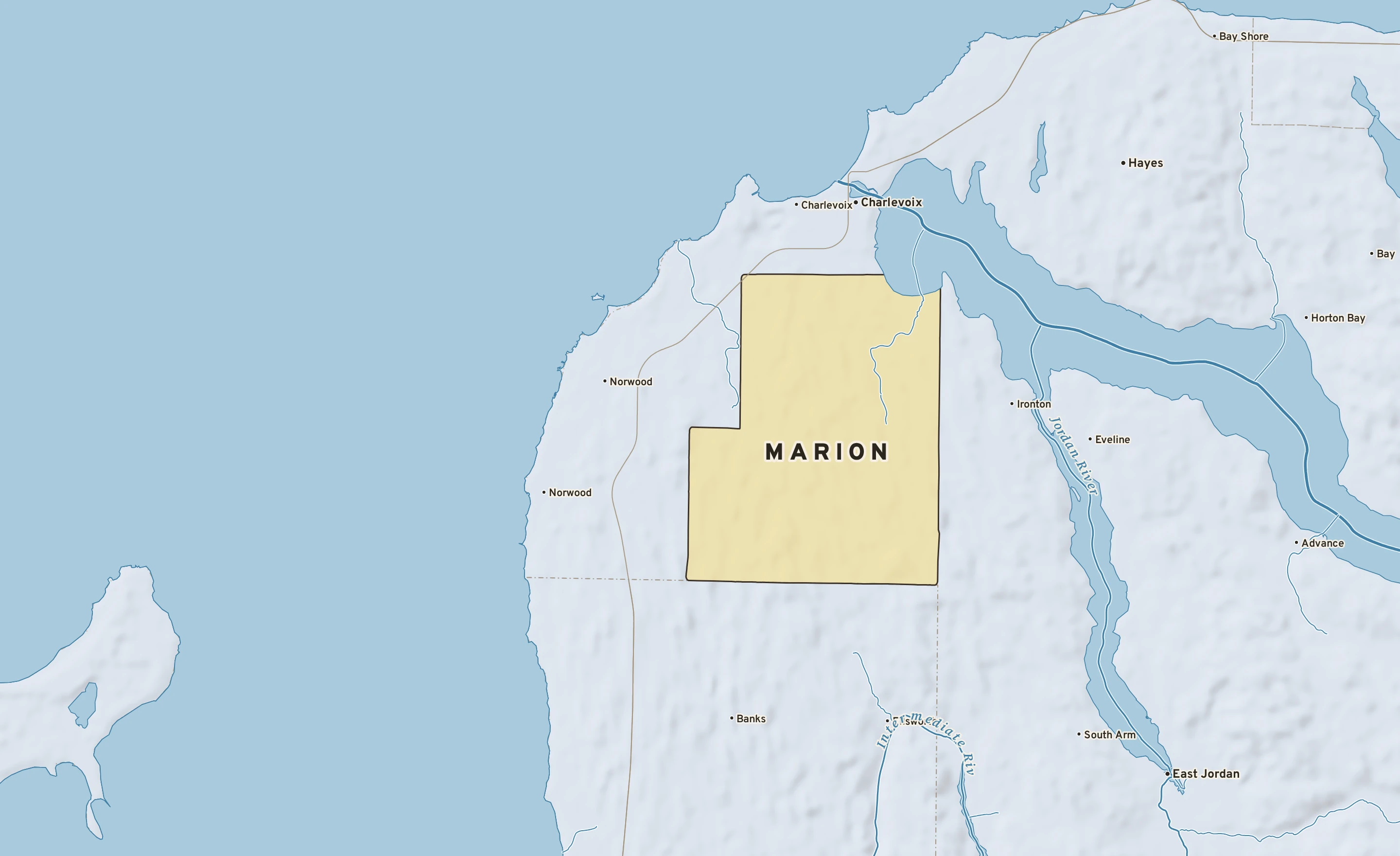 Shaded-relief atlas plate of Marion, Michigan: rivers, roads, the city limits and where the water drains.
