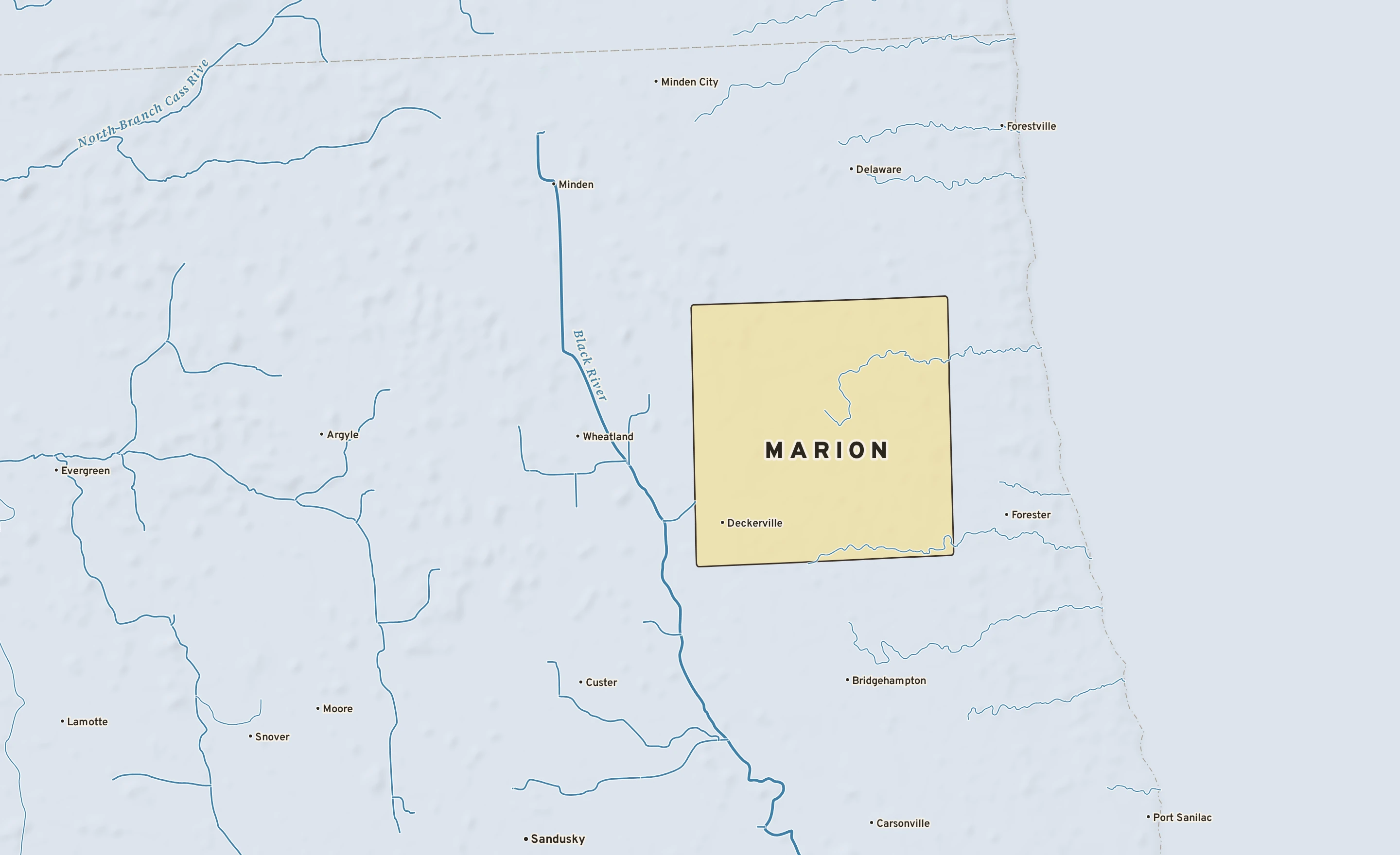 Shaded-relief atlas plate of Marion, Michigan: rivers, roads, the city limits and where the water drains.