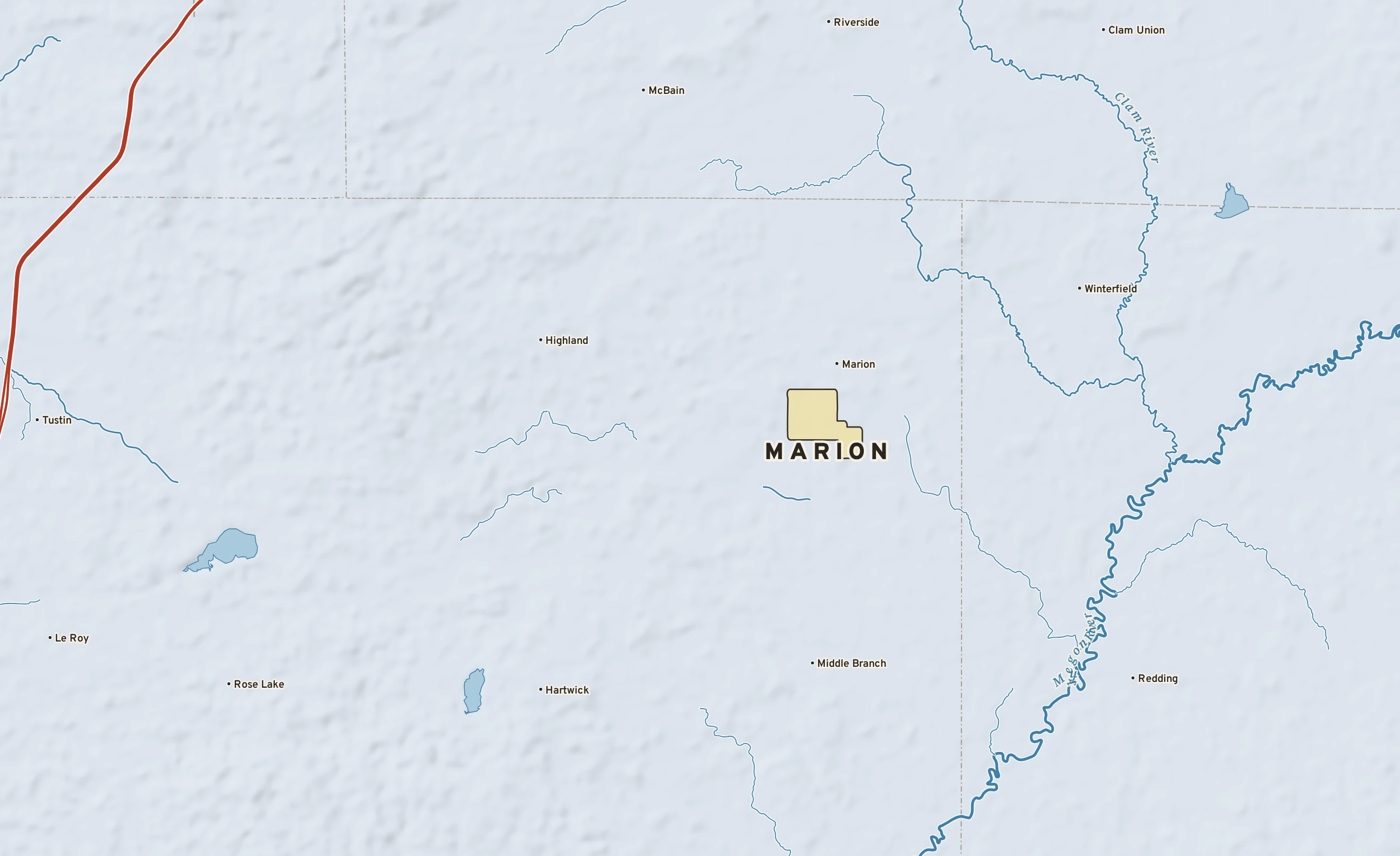 Shaded-relief atlas plate of Marion, Michigan: rivers, roads, the city limits and where the water drains.
