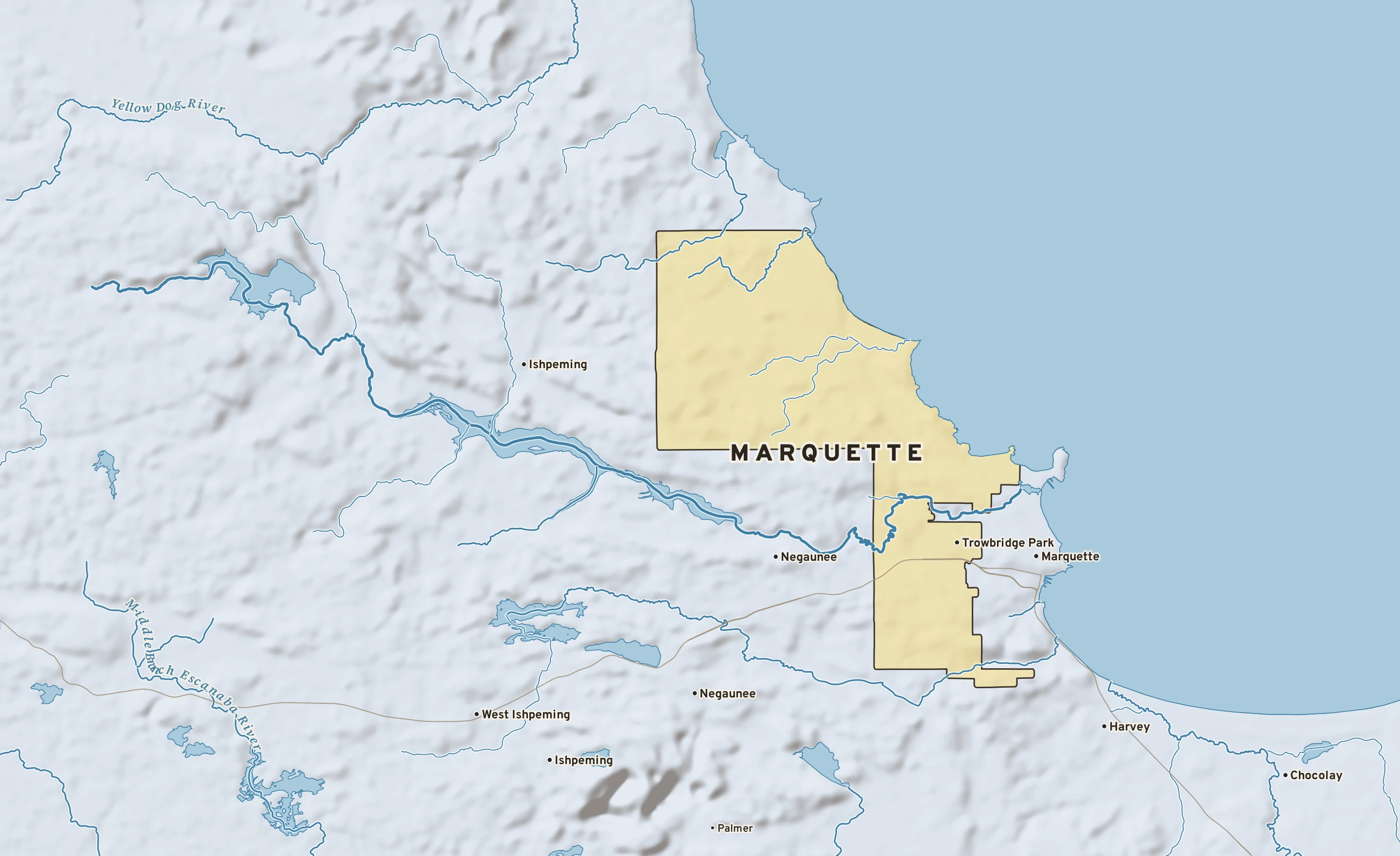 Shaded-relief atlas plate of Marquette, Michigan: rivers, roads, the city limits and where the water drains.