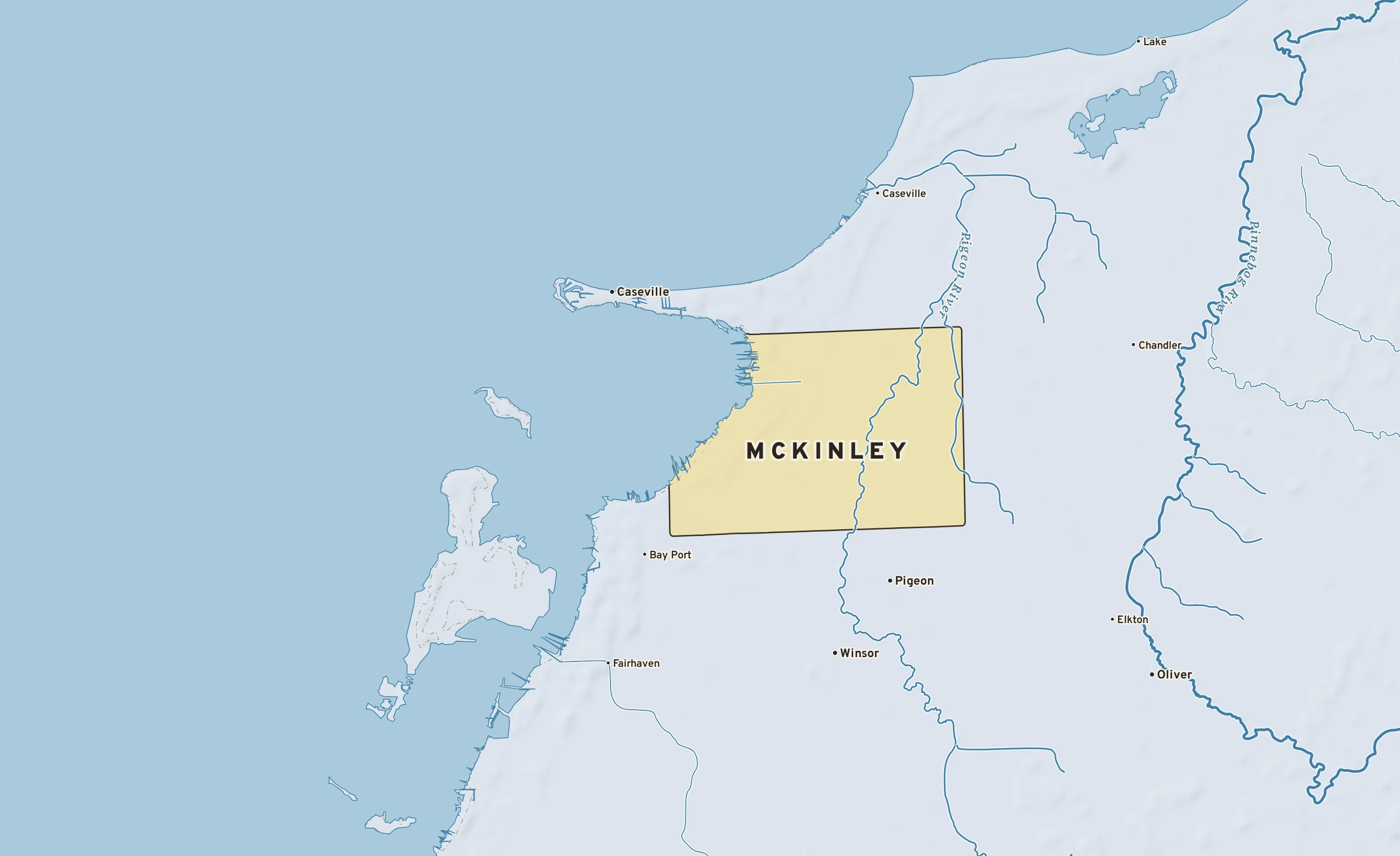 Shaded-relief atlas plate of McKinley, Michigan: rivers, roads, the city limits and where the water drains.