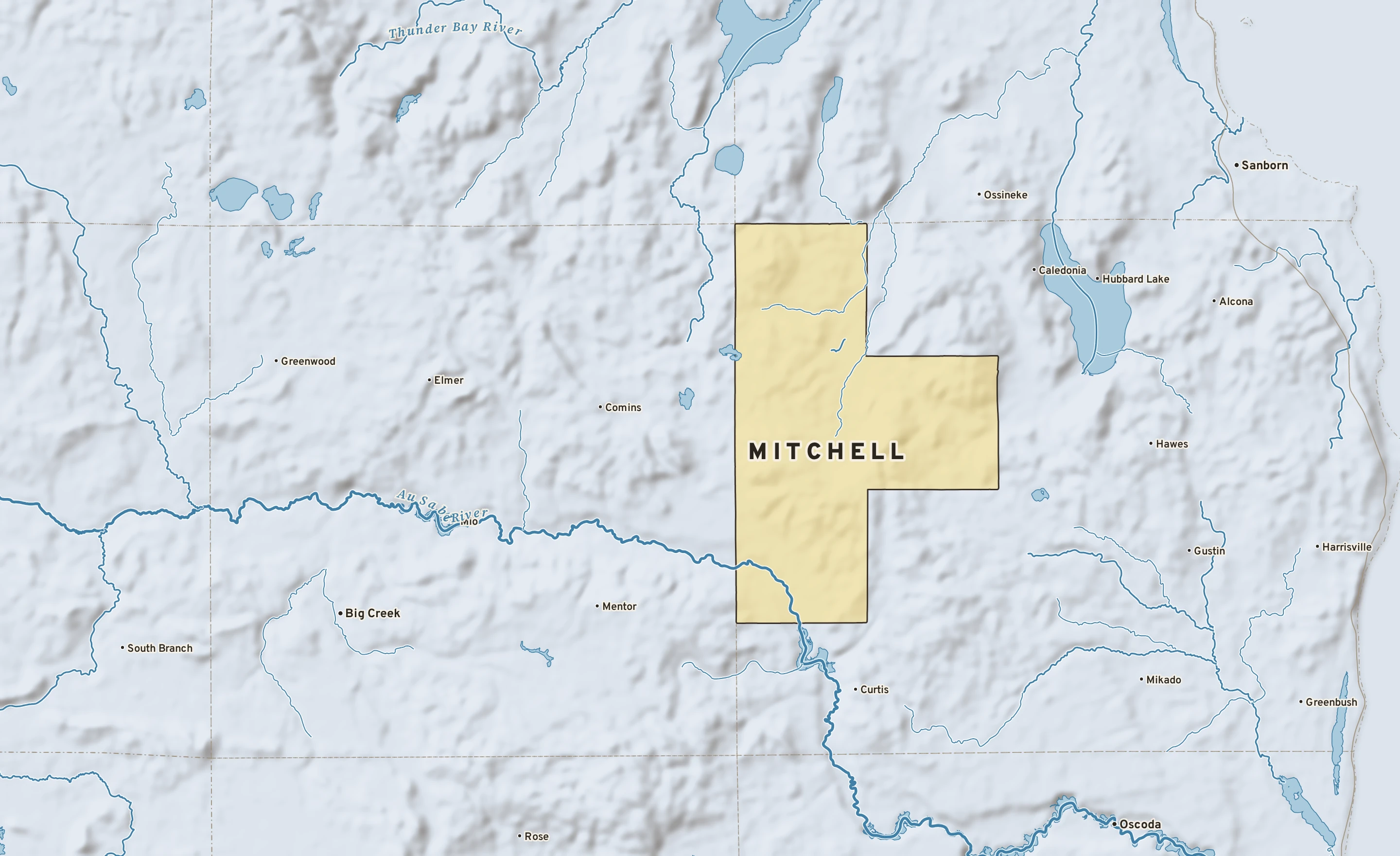 Shaded-relief atlas plate of Mitchell, Michigan: rivers, roads, the city limits and where the water drains.
