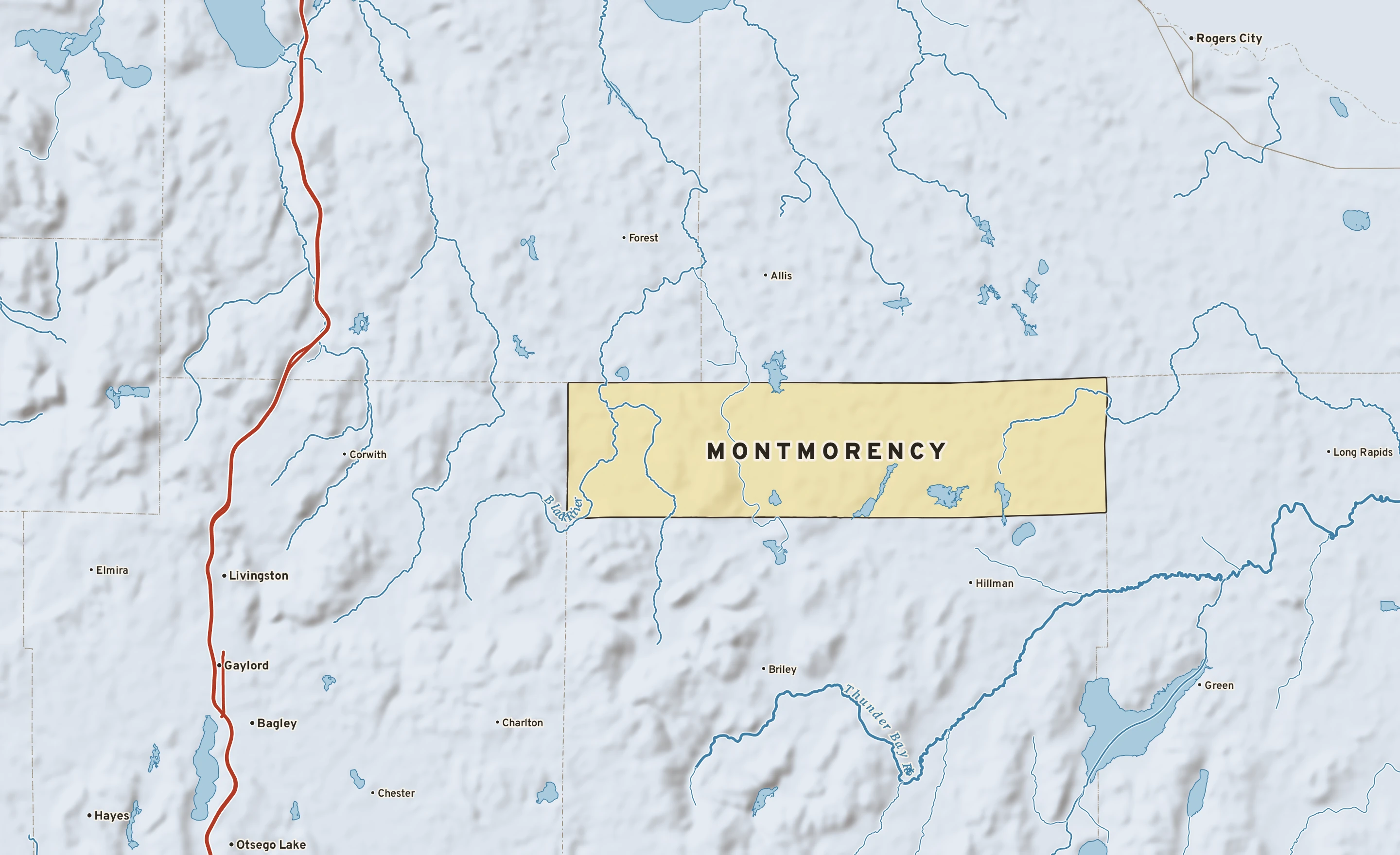 Shaded-relief atlas plate of Montmorency, Michigan: rivers, roads, the city limits and where the water drains.
