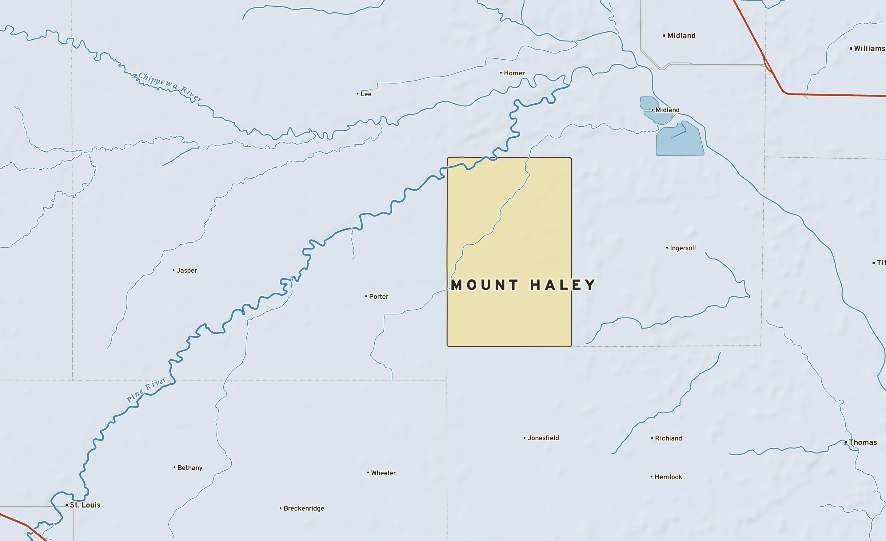 Shaded-relief atlas plate of Mount Haley, Michigan: rivers, roads, the city limits and where the water drains.