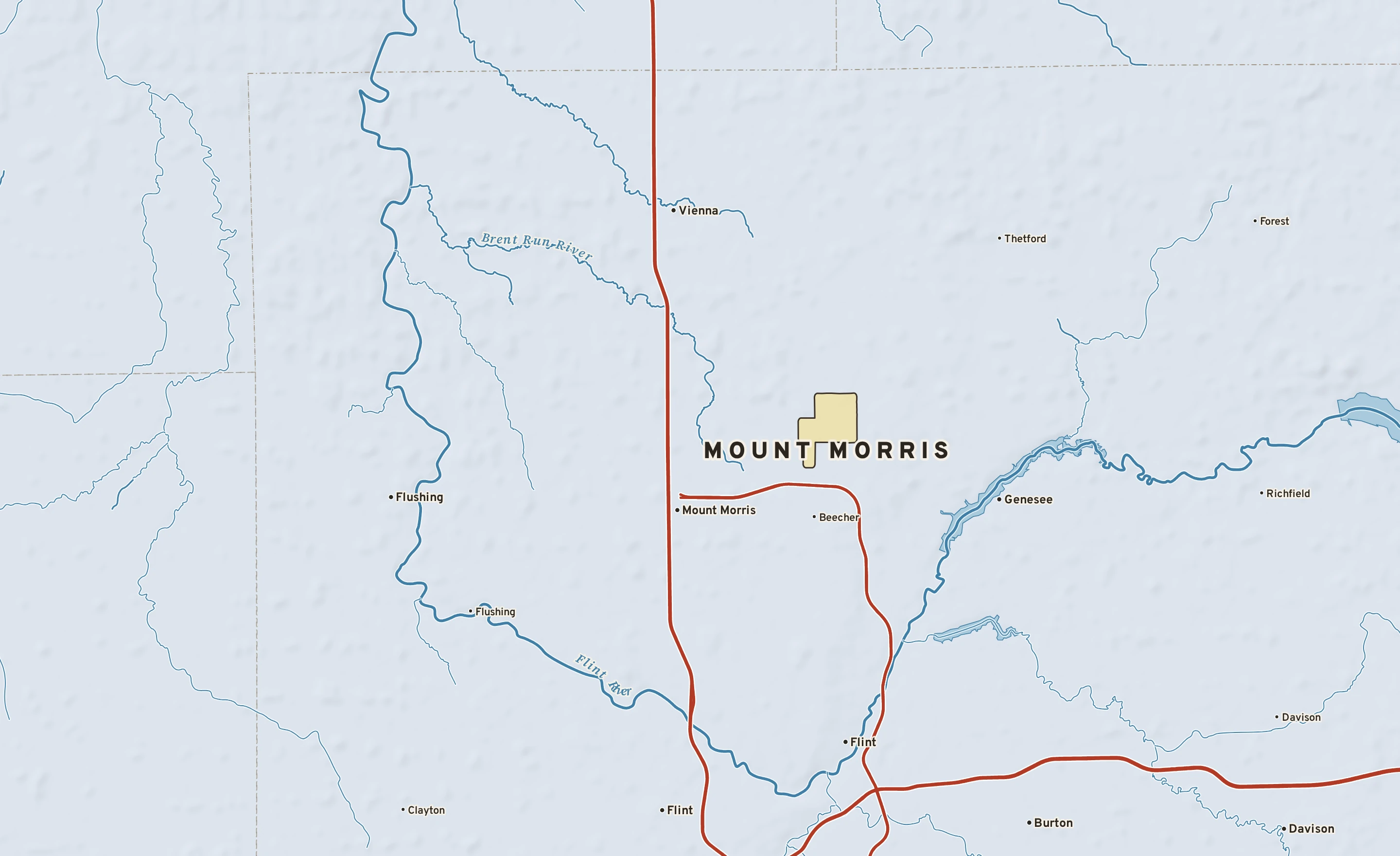 Shaded-relief atlas plate of Mount Morris, Michigan: rivers, roads, the city limits and where the water drains.