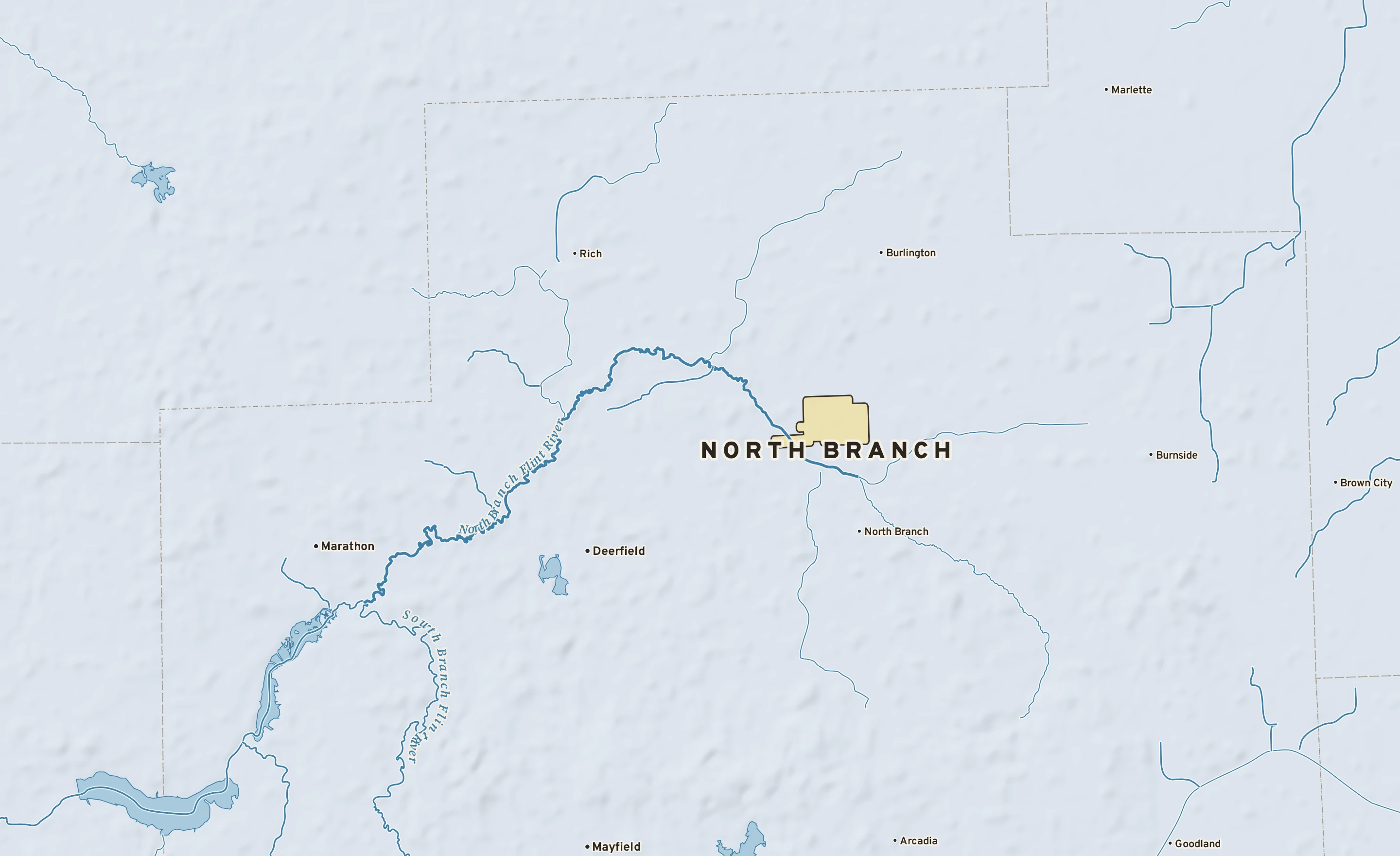 Shaded-relief atlas plate of North Branch, Michigan: rivers, roads, the city limits and where the water drains.