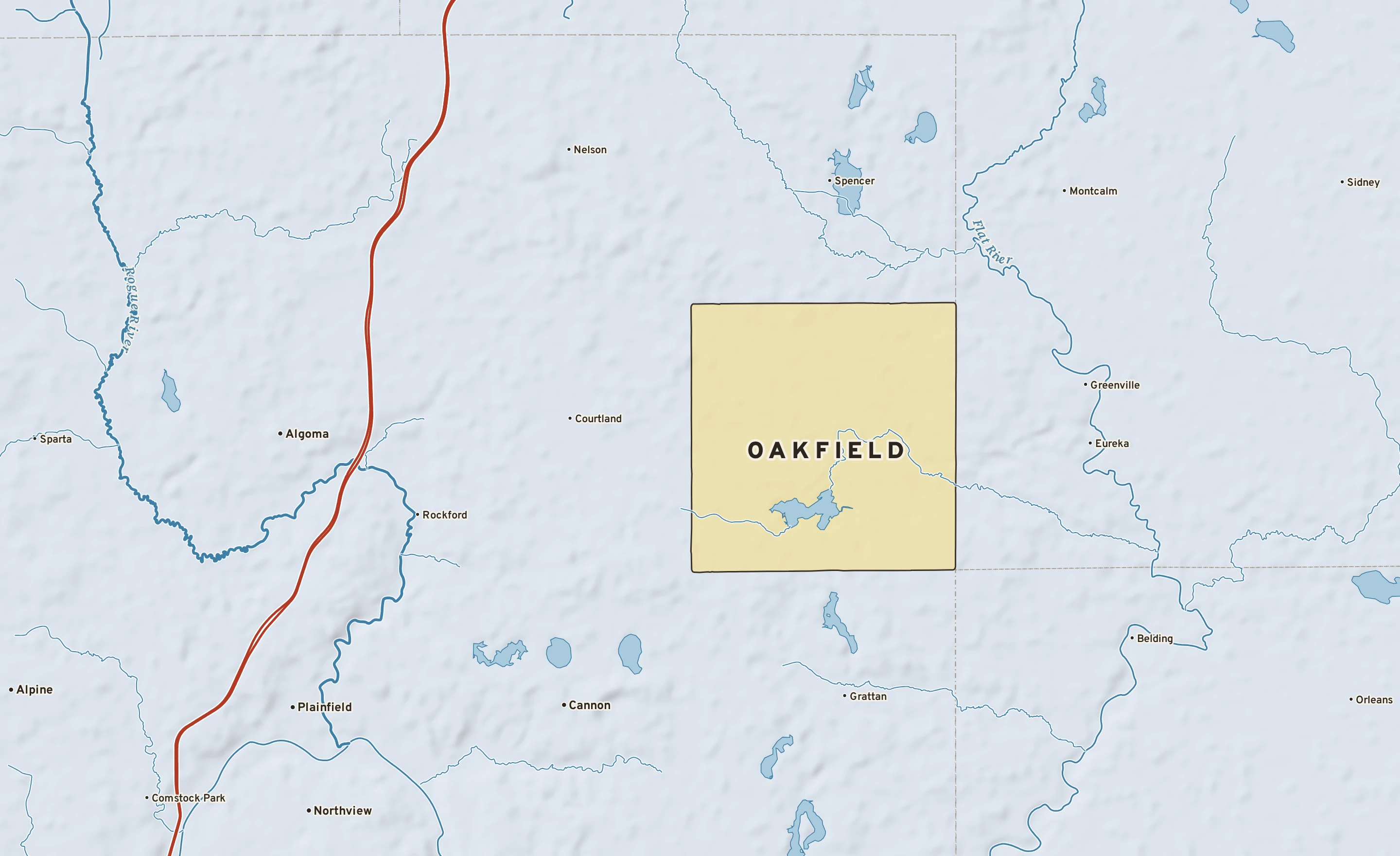 Shaded-relief atlas plate of Oakfield, Michigan: rivers, roads, the city limits and where the water drains.