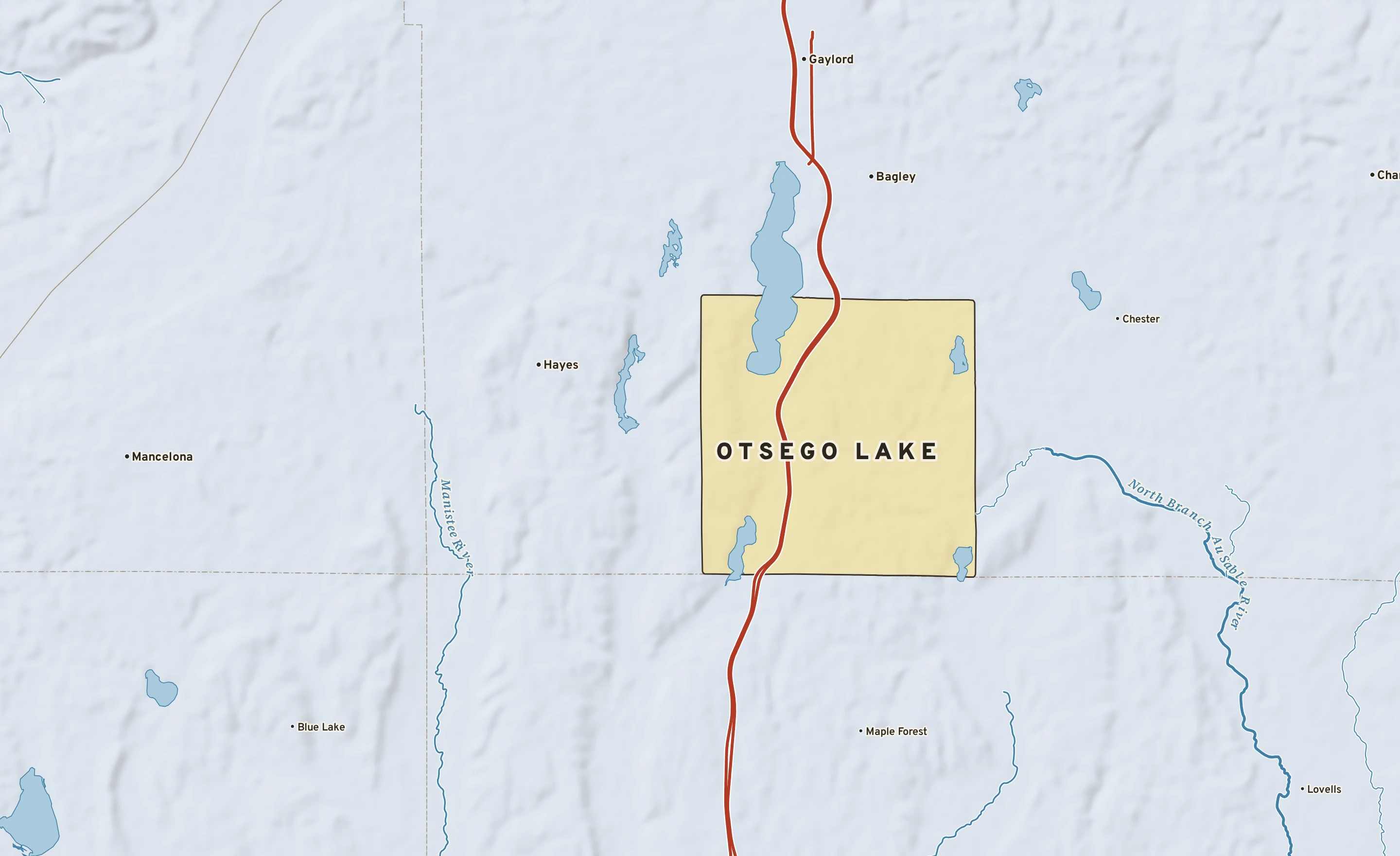 Shaded-relief atlas plate of Otsego Lake, Michigan: rivers, roads, the city limits and where the water drains.