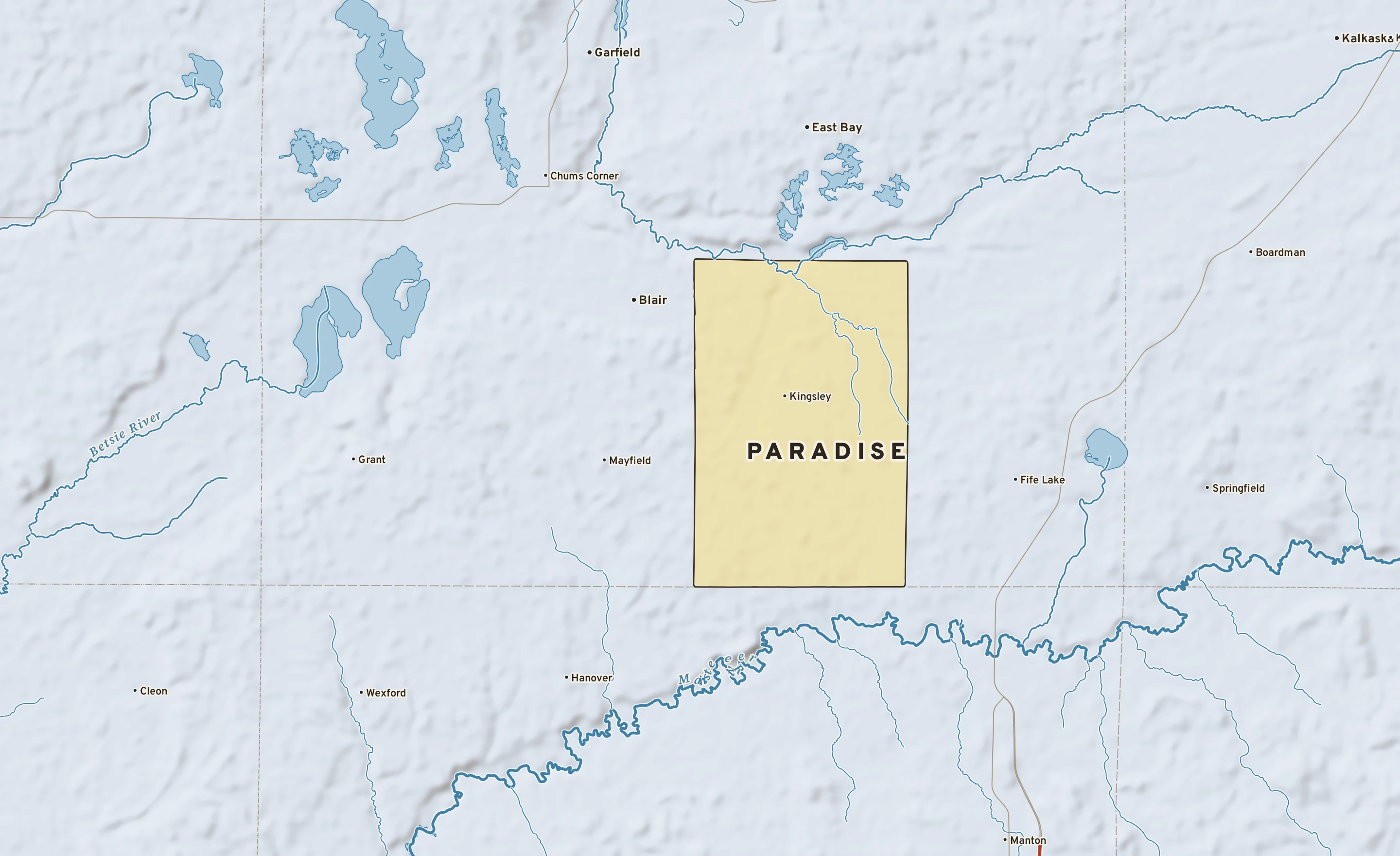 Shaded-relief atlas plate of Paradise, Michigan: rivers, roads, the city limits and where the water drains.