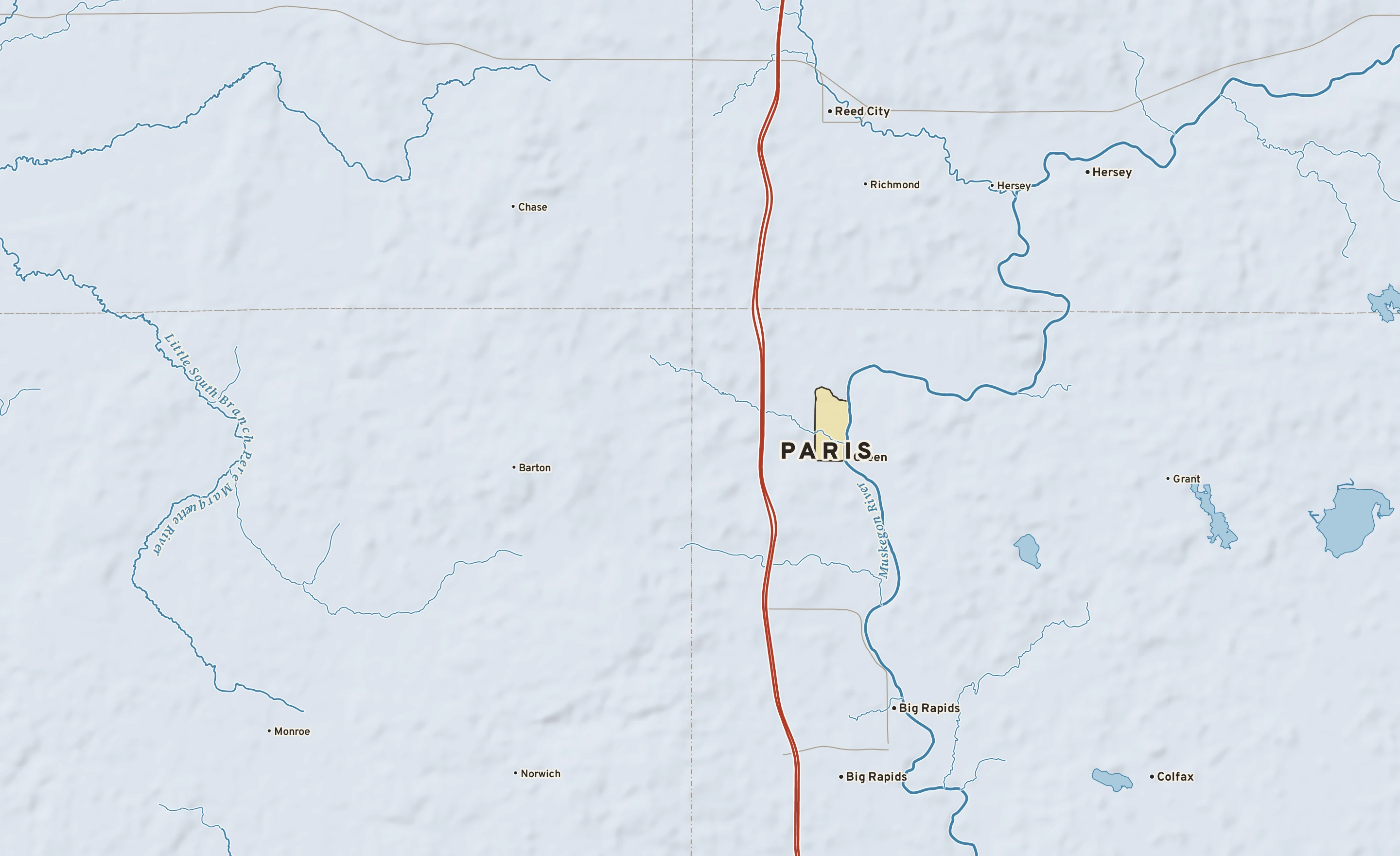 Shaded-relief atlas plate of Paris, Michigan: rivers, roads, the city limits and where the water drains.