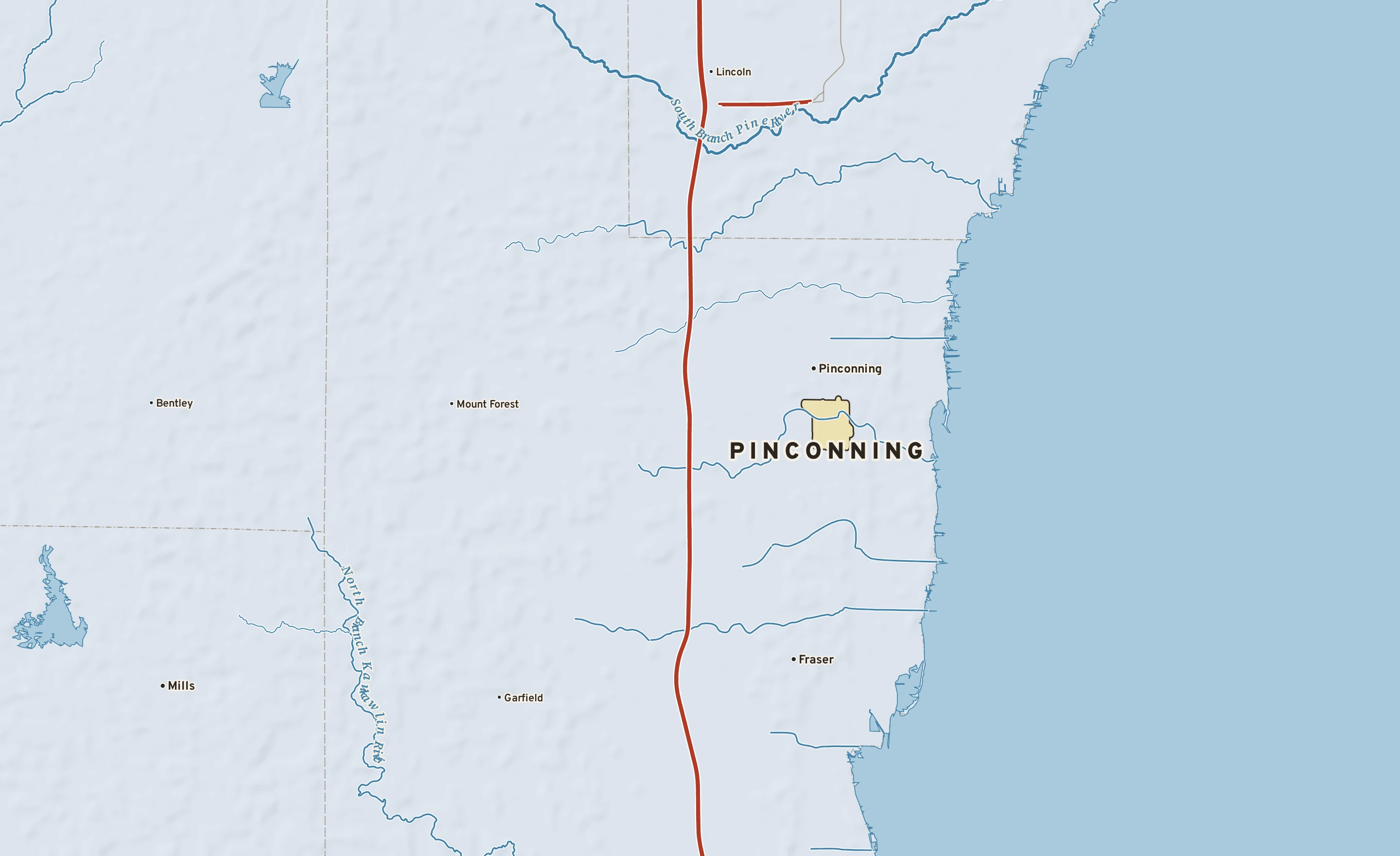 Shaded-relief atlas plate of Pinconning, Michigan: rivers, roads, the city limits and where the water drains.