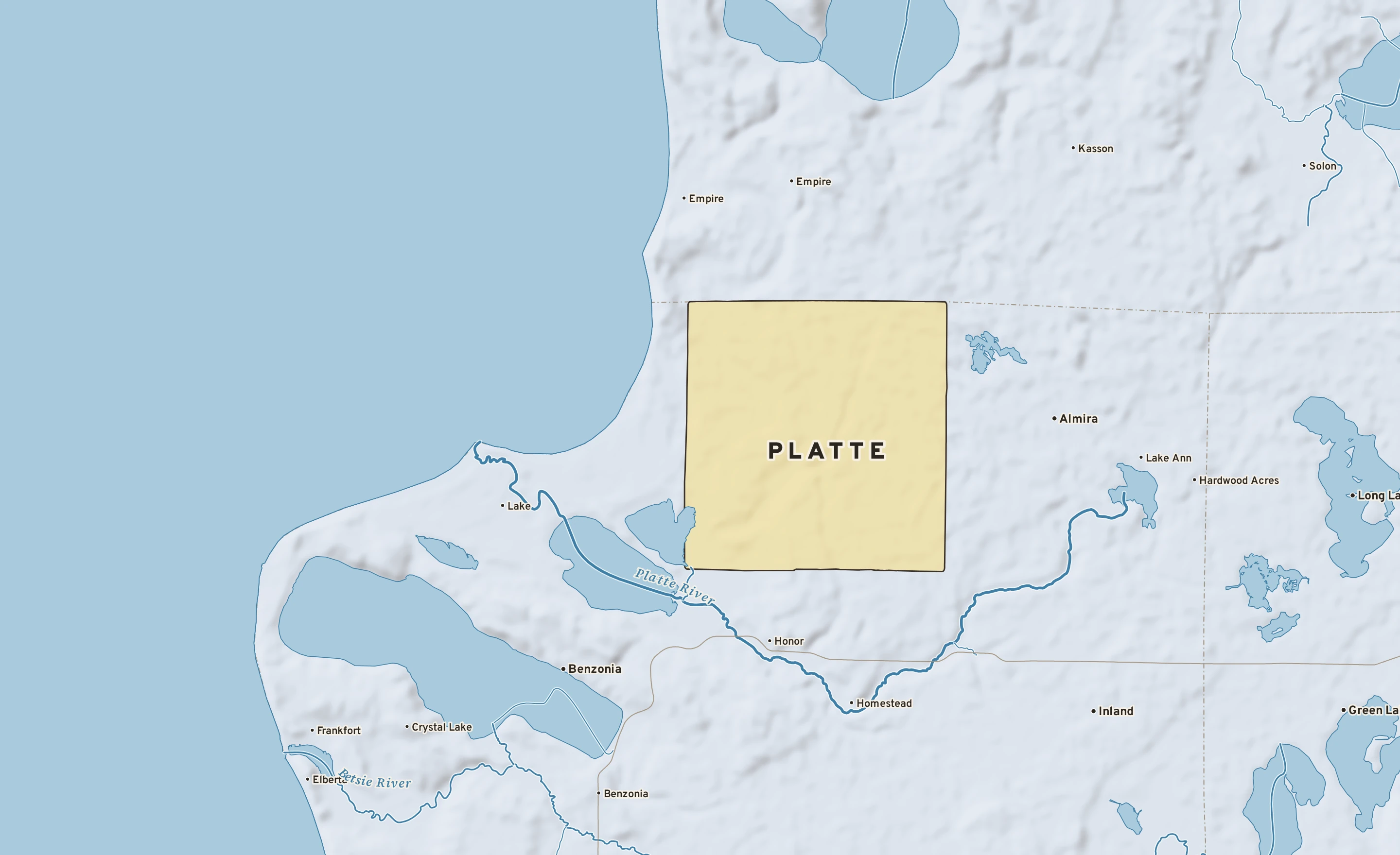 Shaded-relief atlas plate of Platte, Michigan: rivers, roads, the city limits and where the water drains.