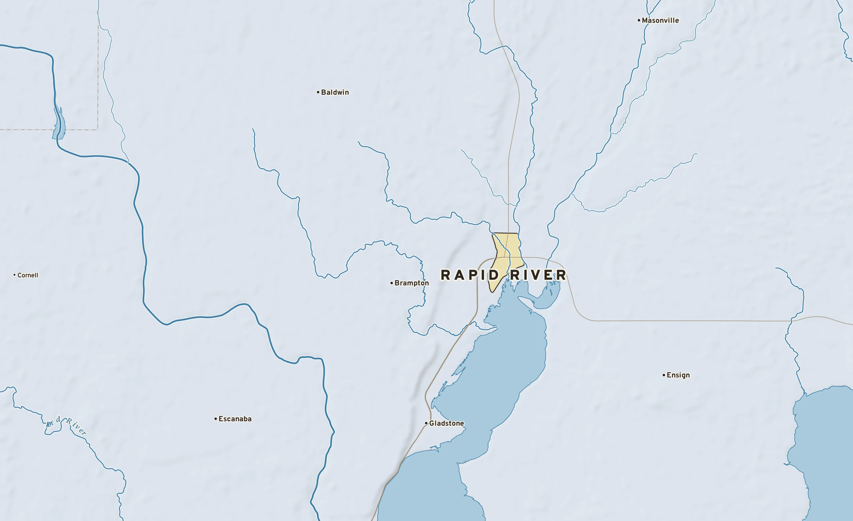 Shaded-relief atlas plate of Rapid River, Michigan: rivers, roads, the city limits and where the water drains.