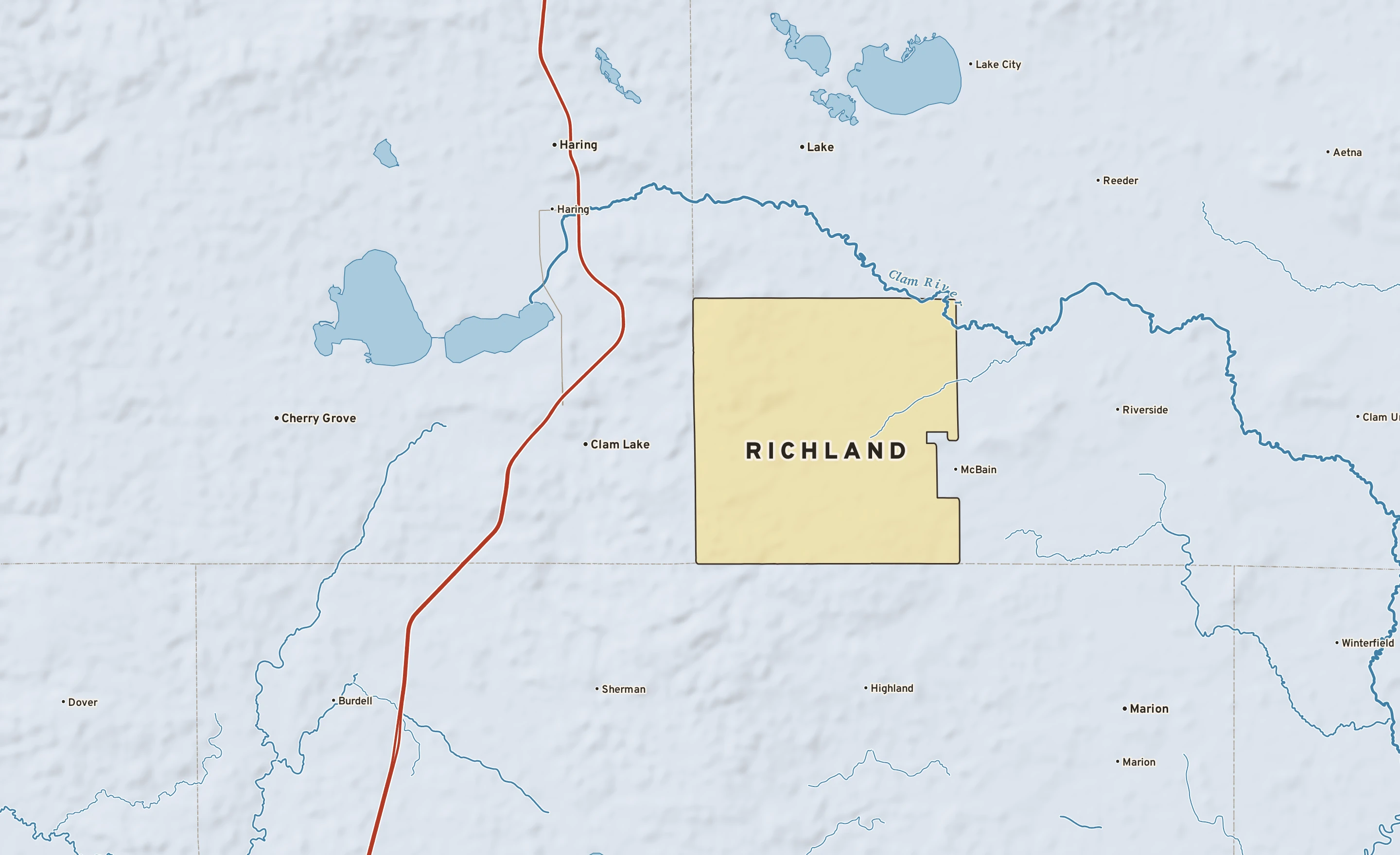 Shaded-relief atlas plate of Richland, Michigan: rivers, roads, the city limits and where the water drains.