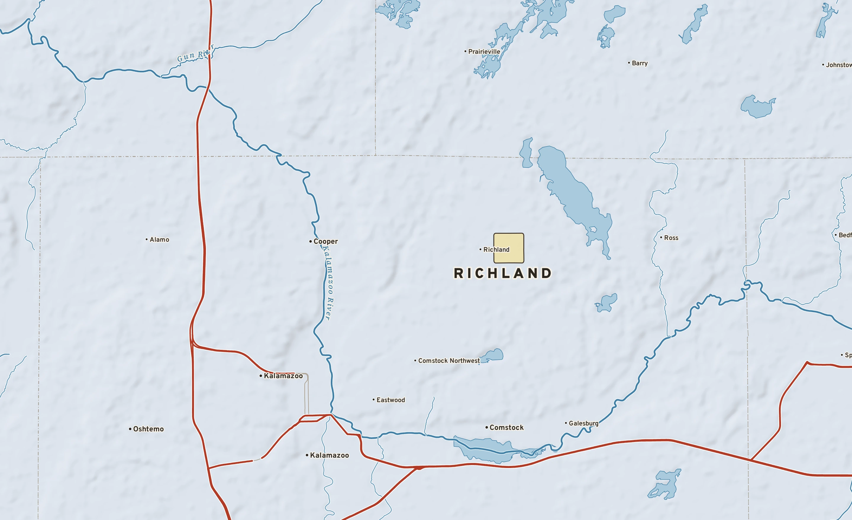 Shaded-relief atlas plate of Richland, Michigan: rivers, roads, the city limits and where the water drains.