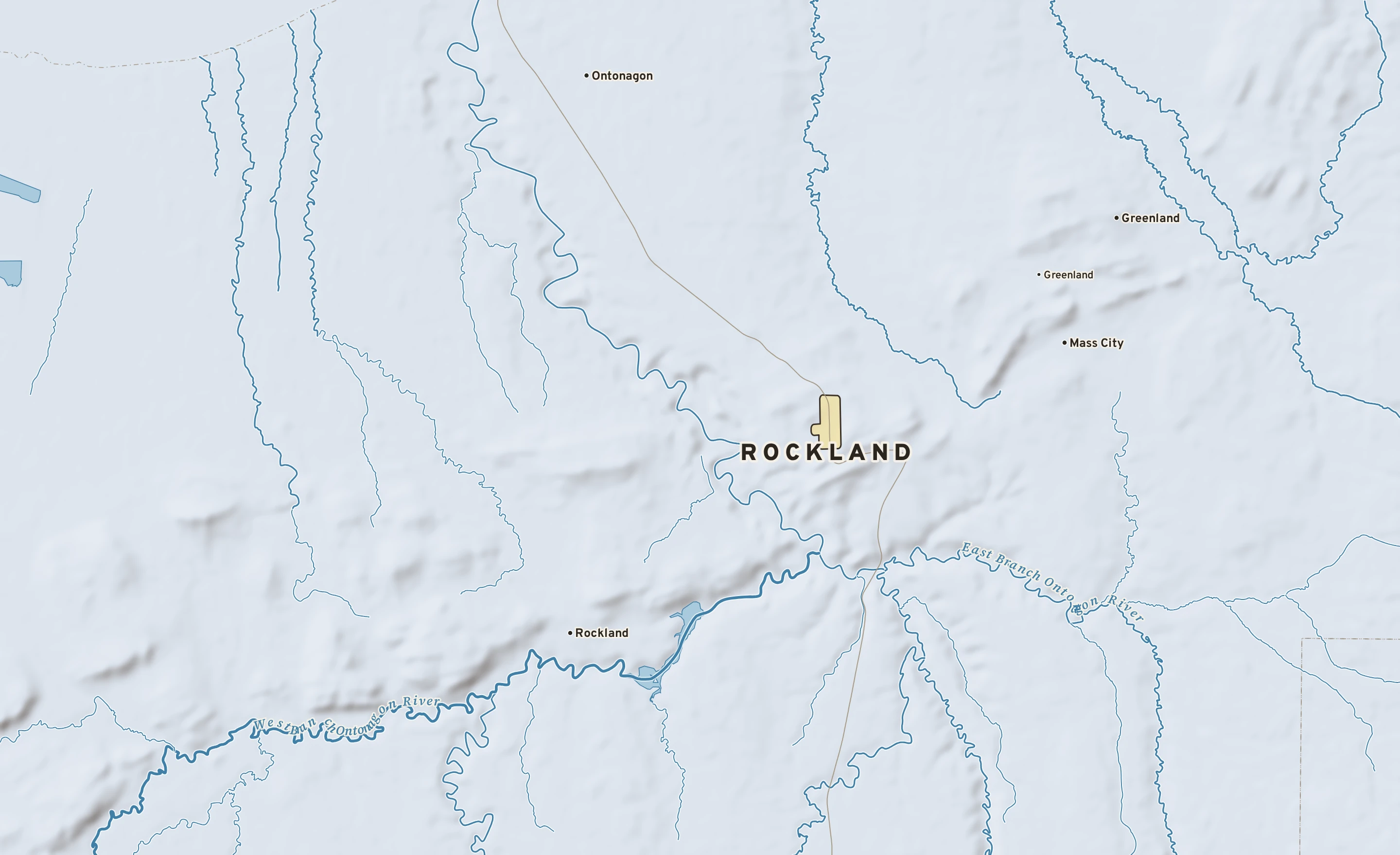 Shaded-relief atlas plate of Rockland, Michigan: rivers, roads, the city limits and where the water drains.