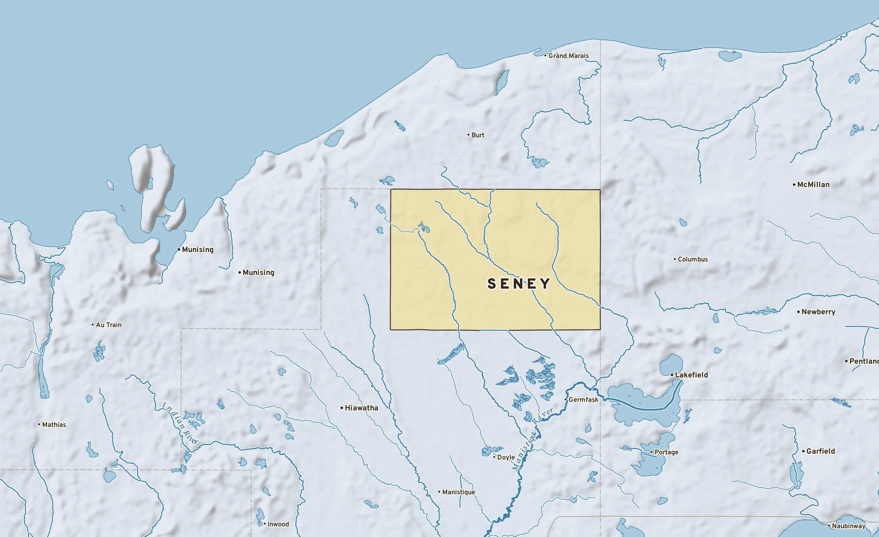 Shaded-relief atlas plate of Seney, Michigan: rivers, roads, the city limits and where the water drains.