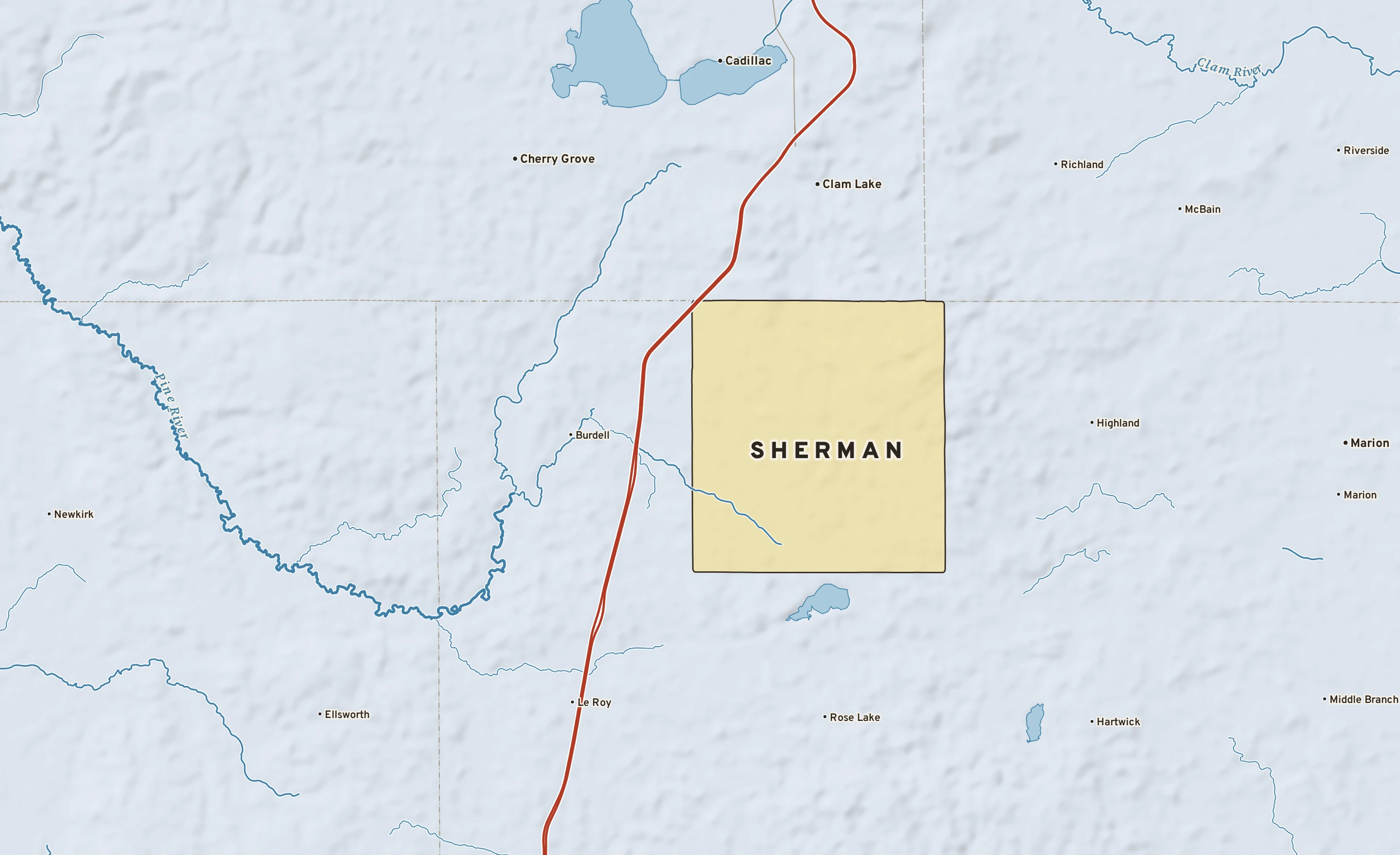Shaded-relief atlas plate of Sherman, Michigan: rivers, roads, the city limits and where the water drains.
