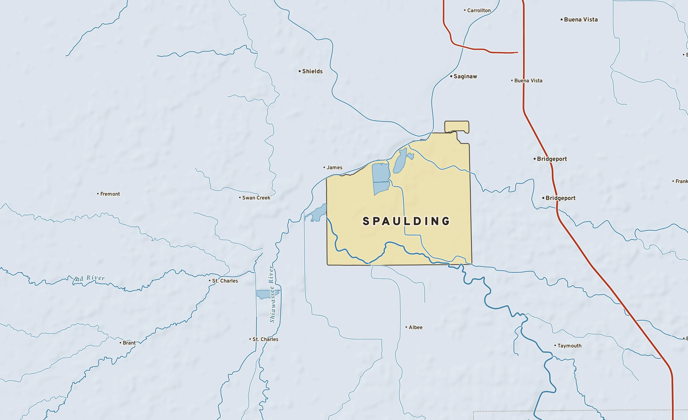 Shaded-relief atlas plate of Spaulding, Michigan: rivers, roads, the city limits and where the water drains.
