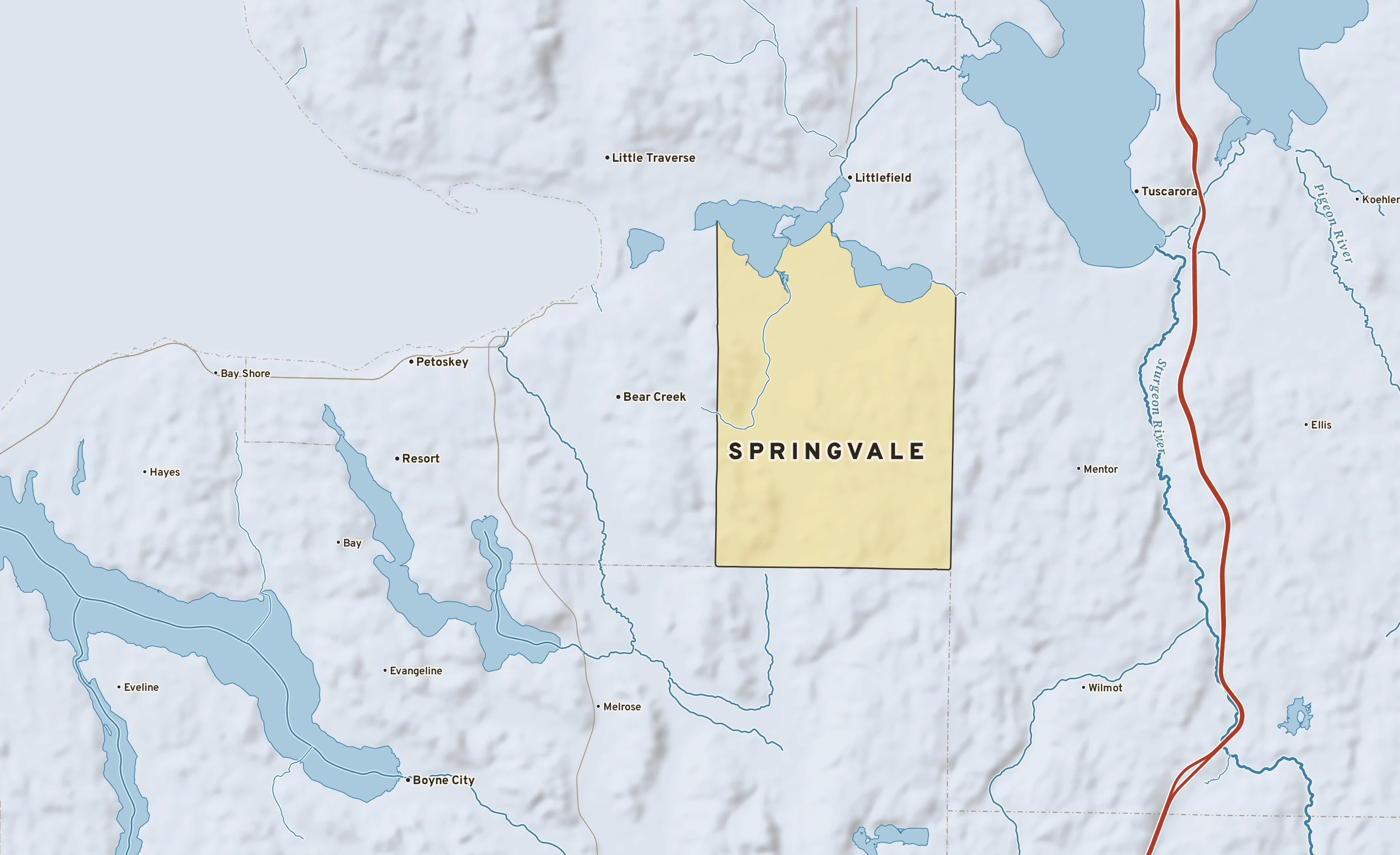 Shaded-relief atlas plate of Springvale, Michigan: rivers, roads, the city limits and where the water drains.