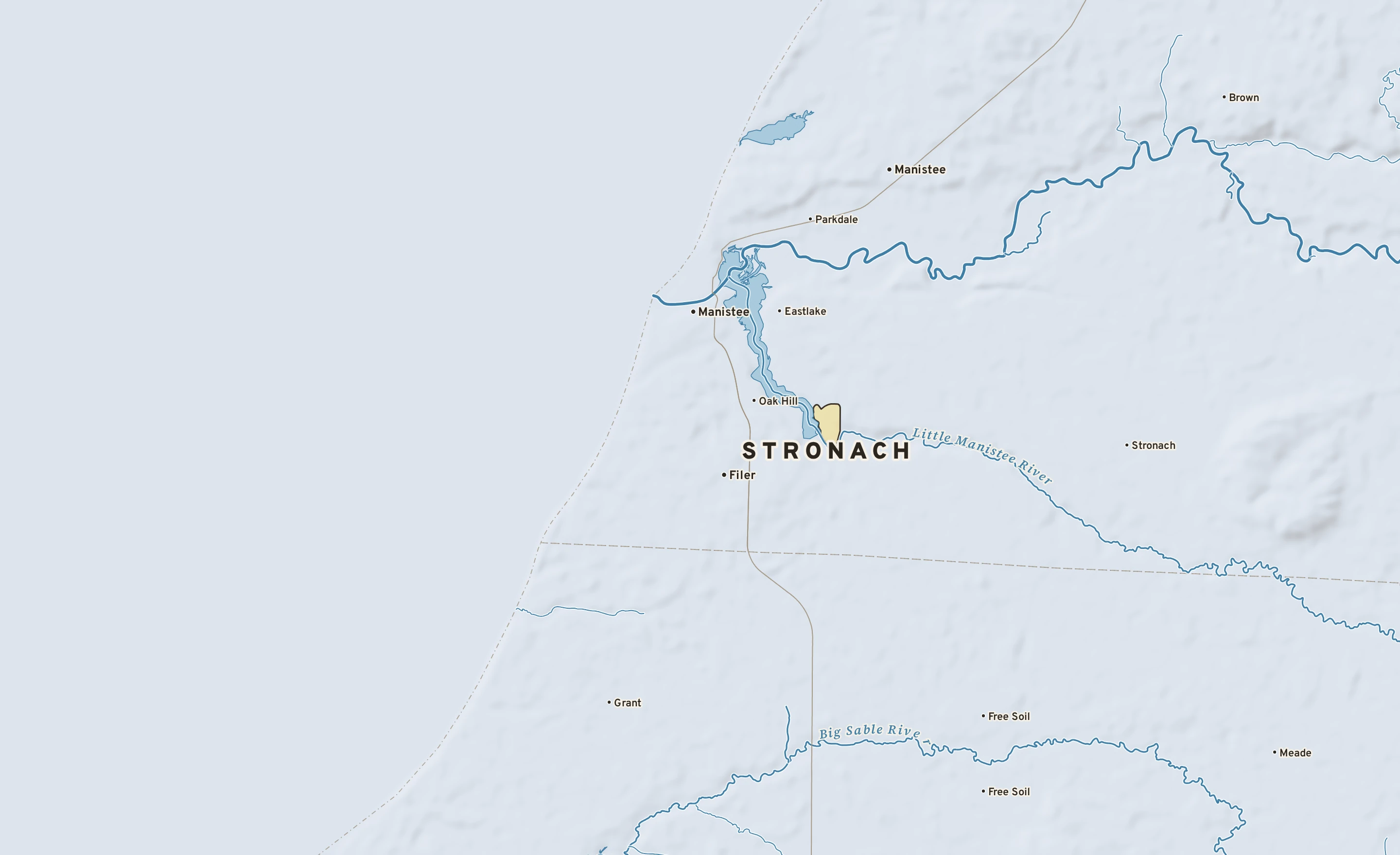 Shaded-relief atlas plate of Stronach, Michigan: rivers, roads, the city limits and where the water drains.