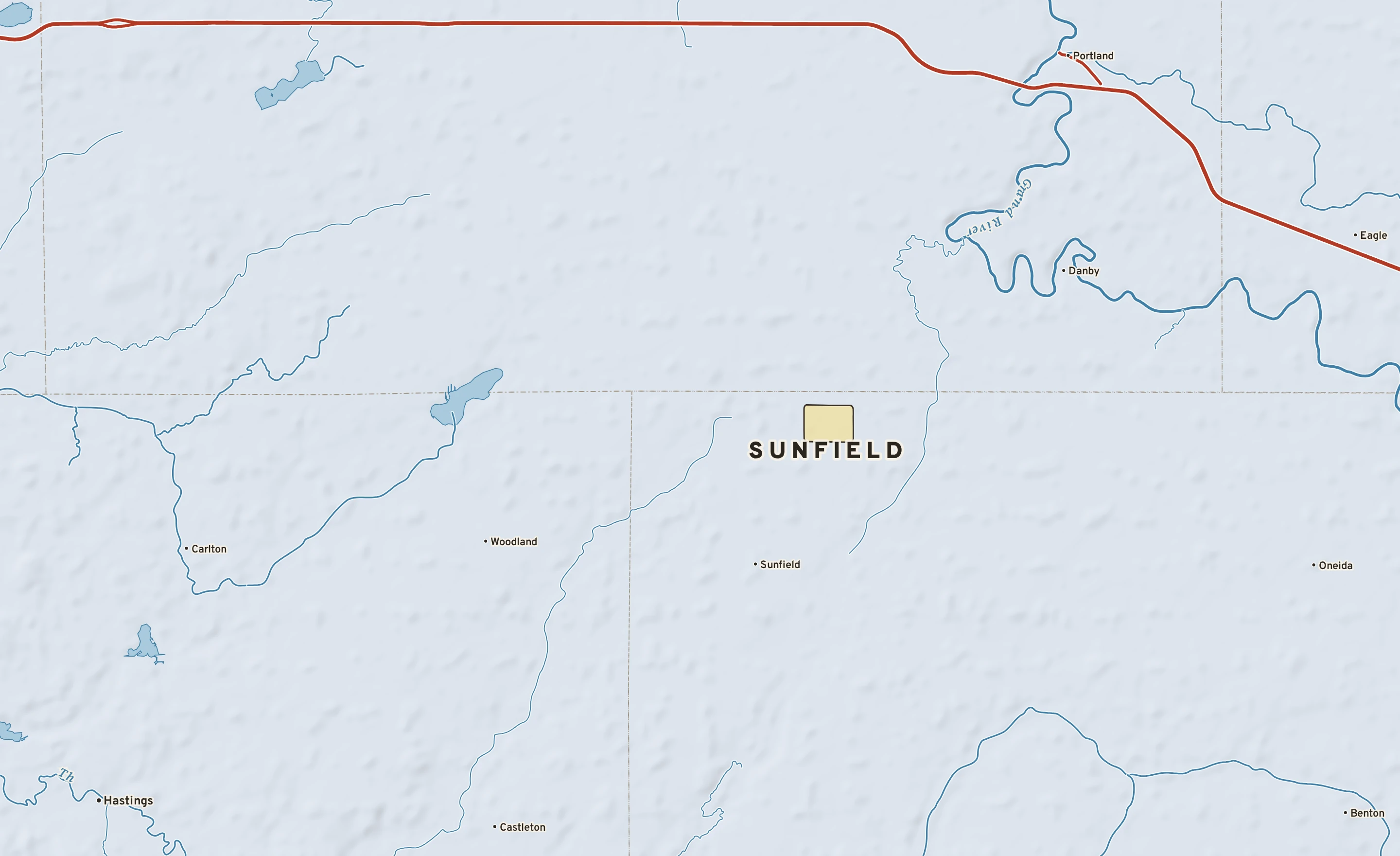 Shaded-relief atlas plate of Sunfield, Michigan: rivers, roads, the city limits and where the water drains.