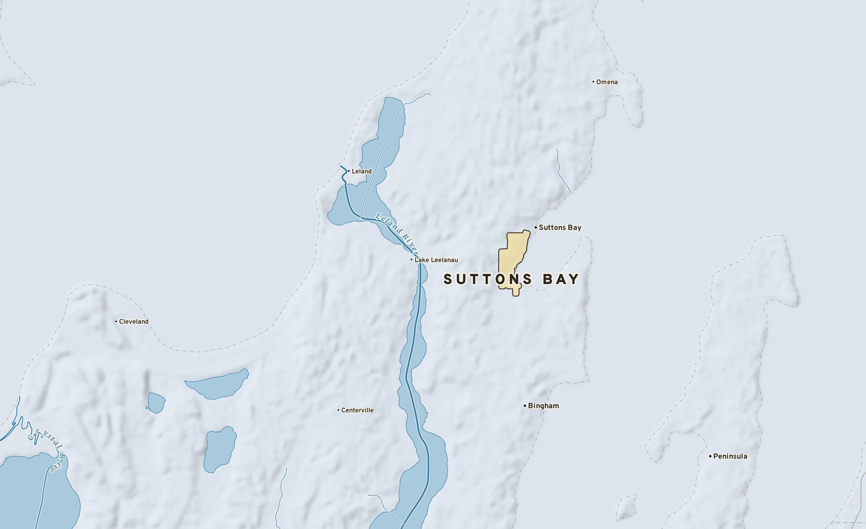 Shaded-relief atlas plate of Suttons Bay, Michigan: rivers, roads, the city limits and where the water drains.