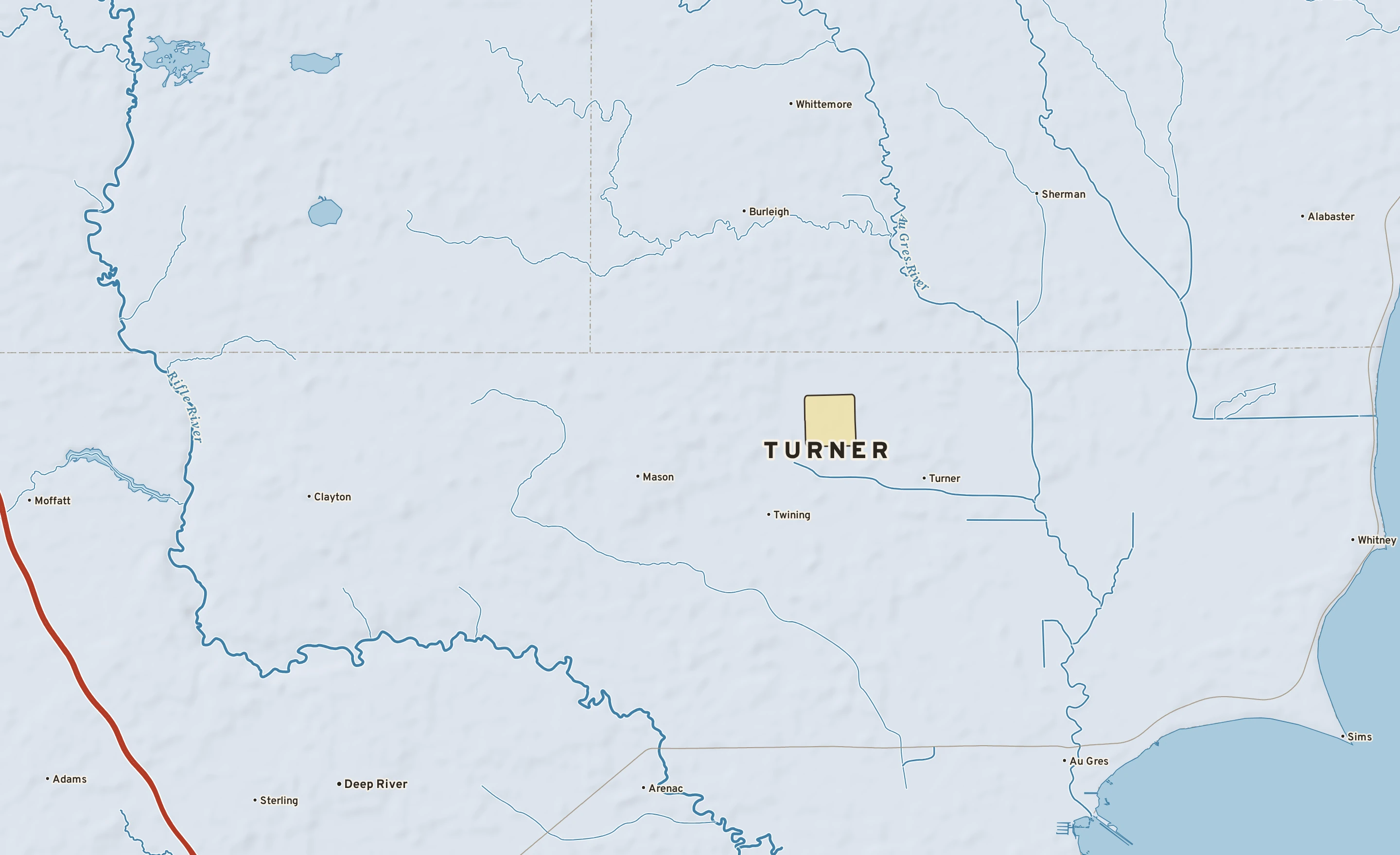 Shaded-relief atlas plate of Turner, Michigan: rivers, roads, the city limits and where the water drains.