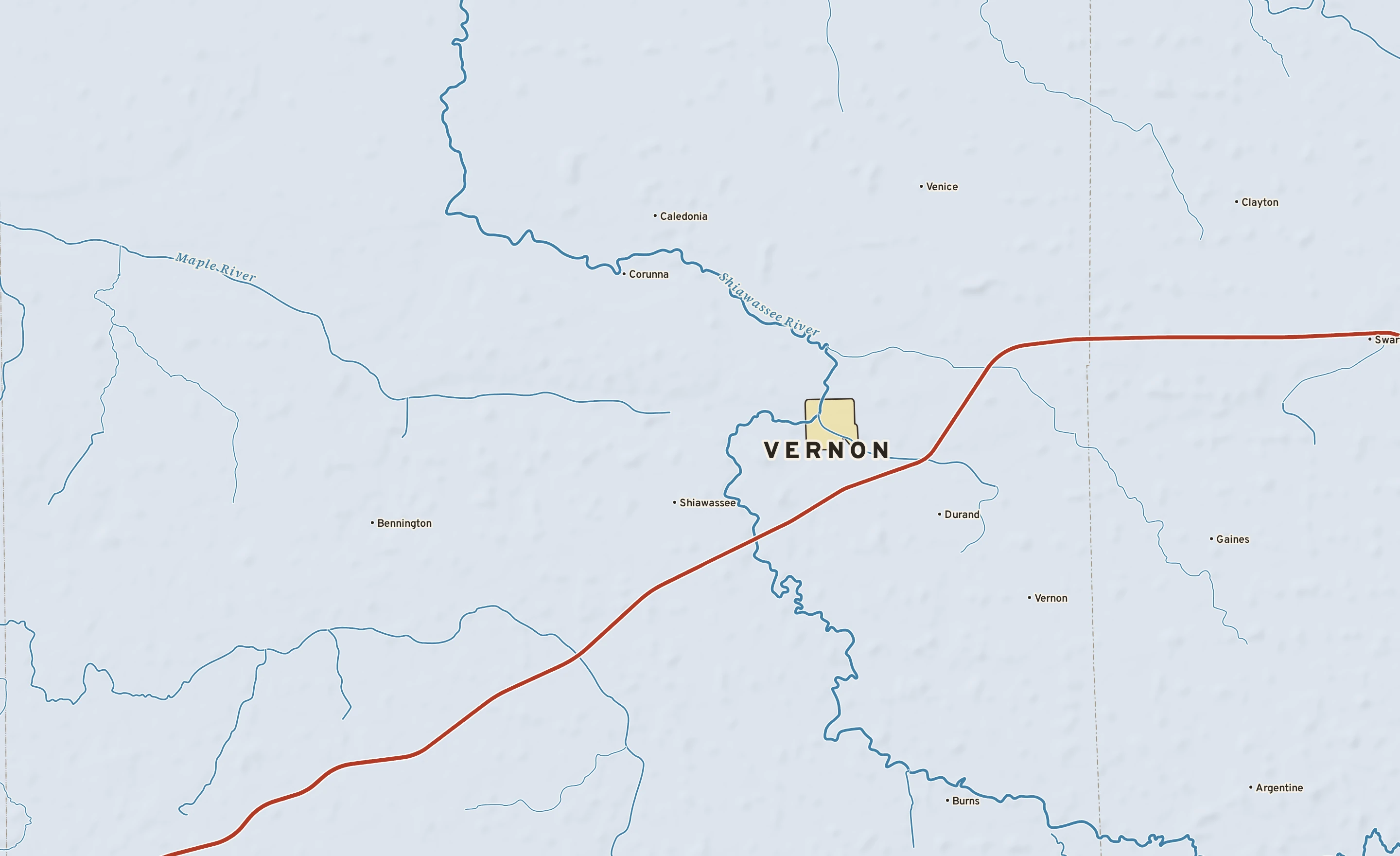 Shaded-relief atlas plate of Vernon, Michigan: rivers, roads, the city limits and where the water drains.