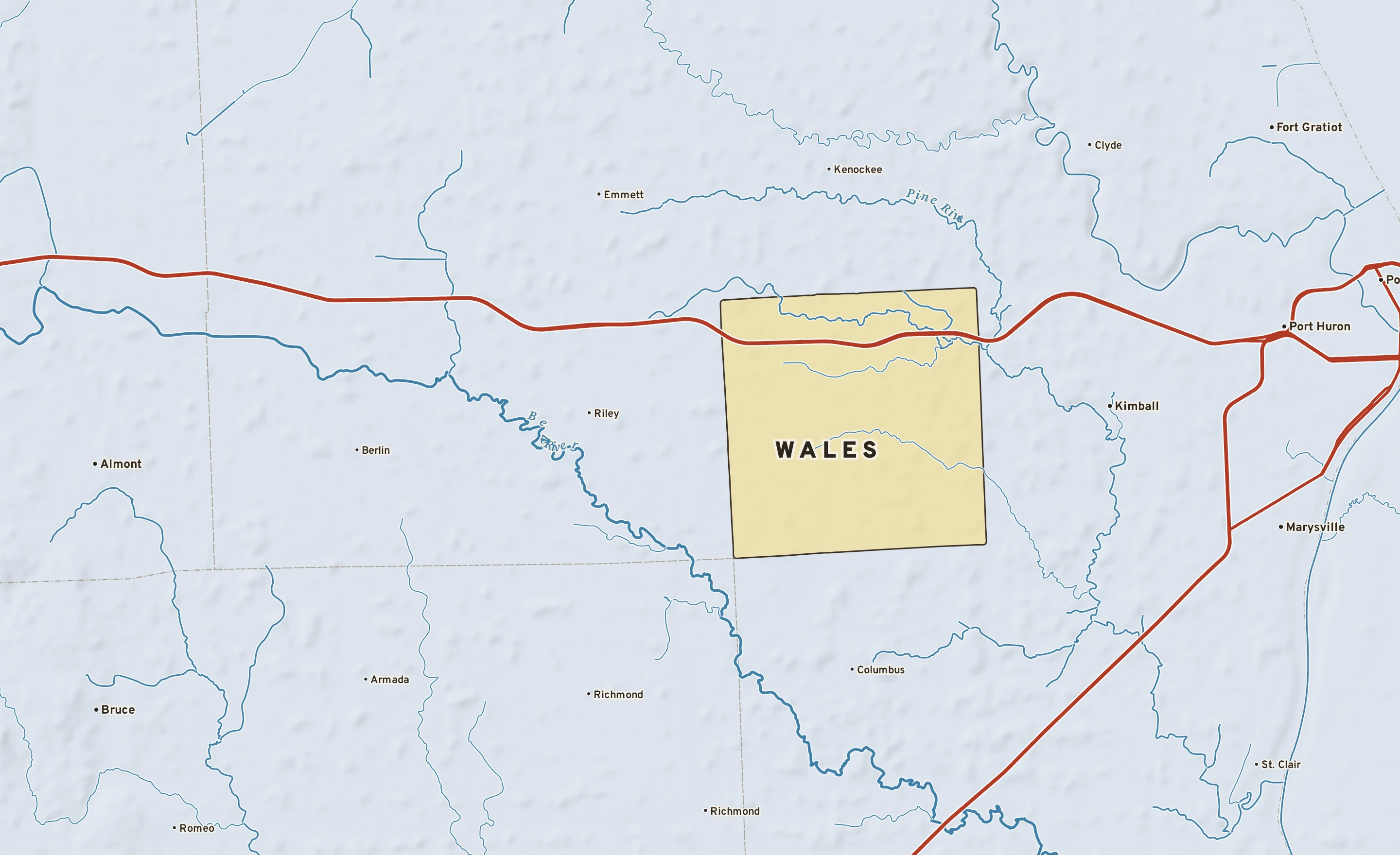 Shaded-relief atlas plate of Wales, Michigan: rivers, roads, the city limits and where the water drains.