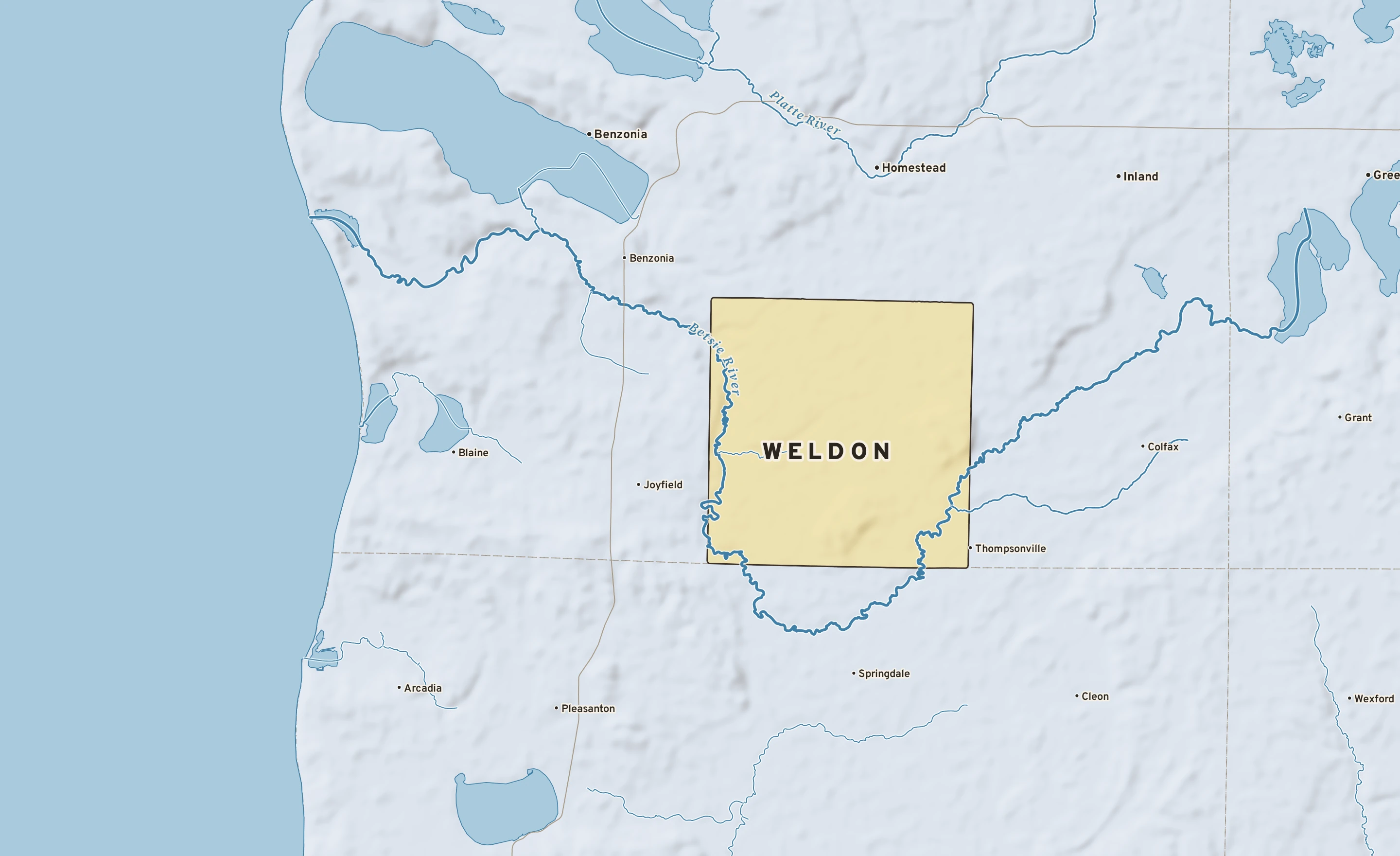 Shaded-relief atlas plate of Weldon, Michigan: rivers, roads, the city limits and where the water drains.
