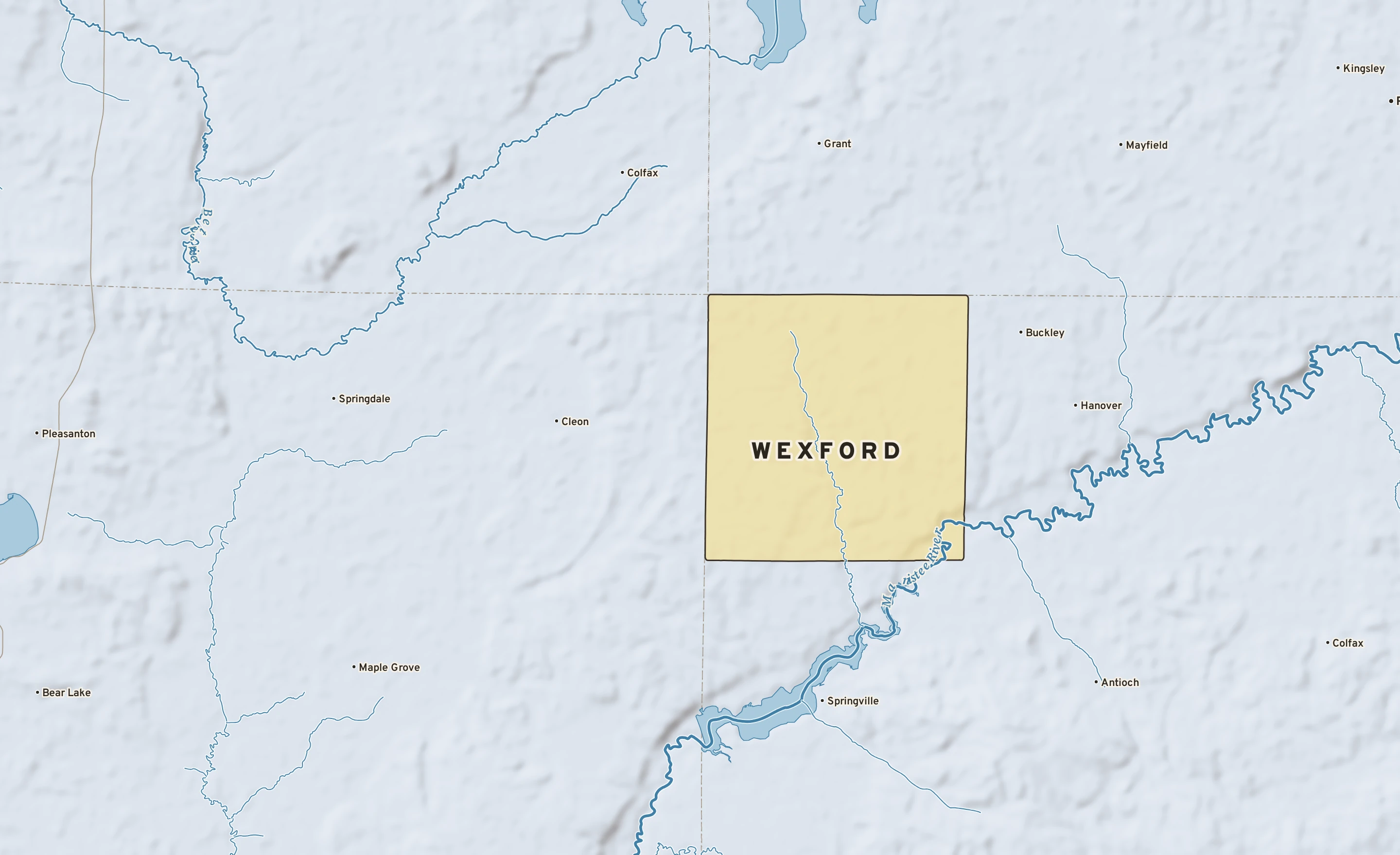 Shaded-relief atlas plate of Wexford, Michigan: rivers, roads, the city limits and where the water drains.