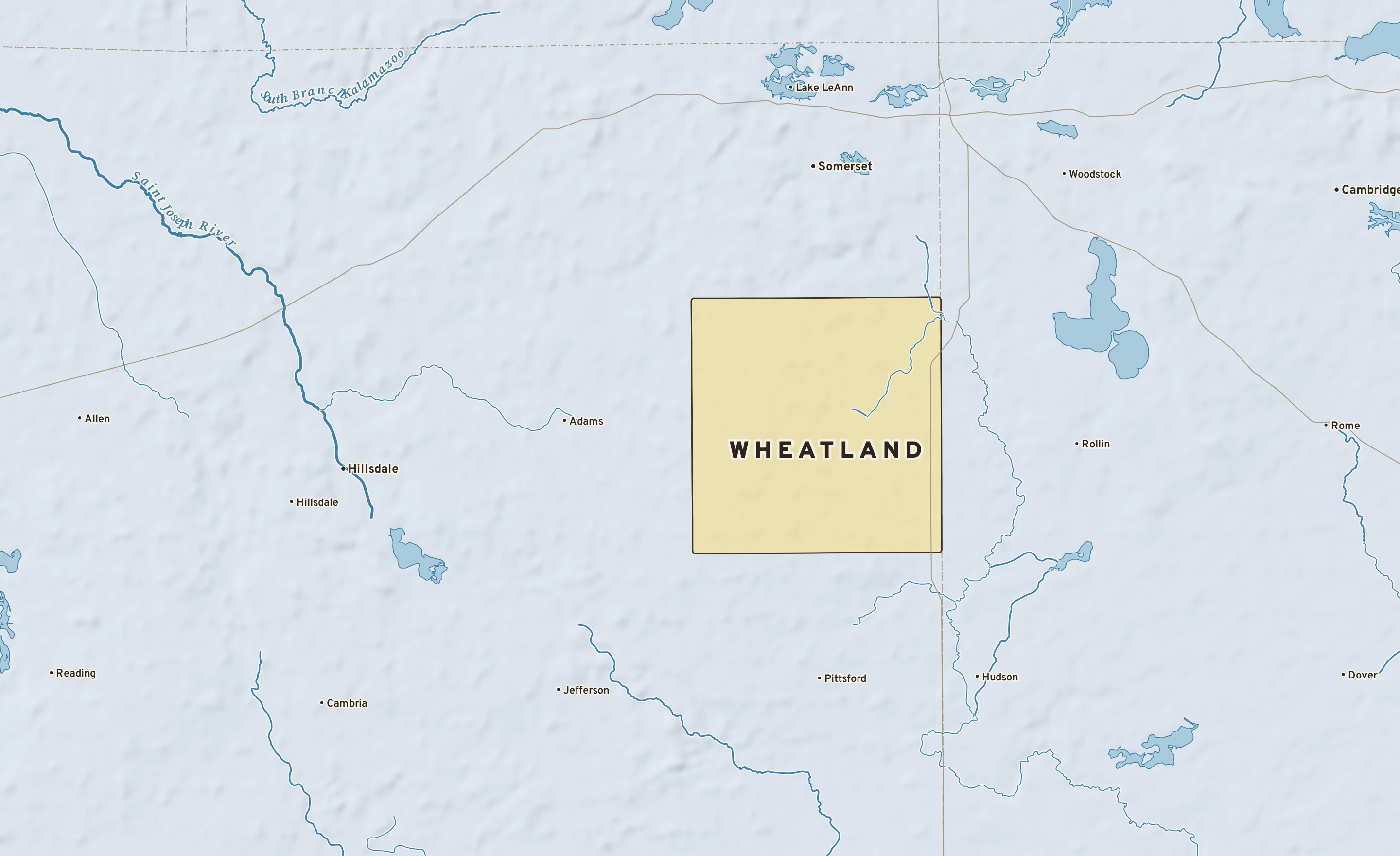 Shaded-relief atlas plate of Wheatland, Michigan: rivers, roads, the city limits and where the water drains.