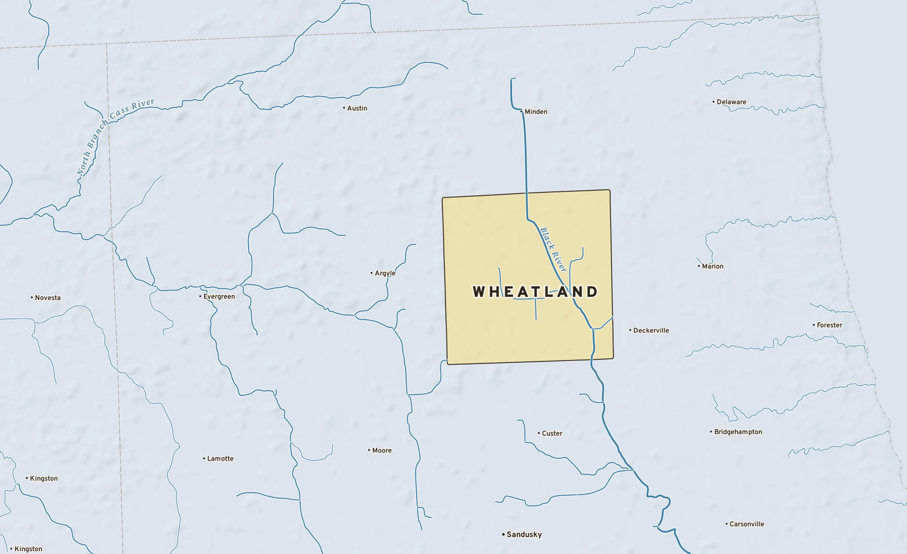 Shaded-relief atlas plate of Wheatland, Michigan: rivers, roads, the city limits and where the water drains.