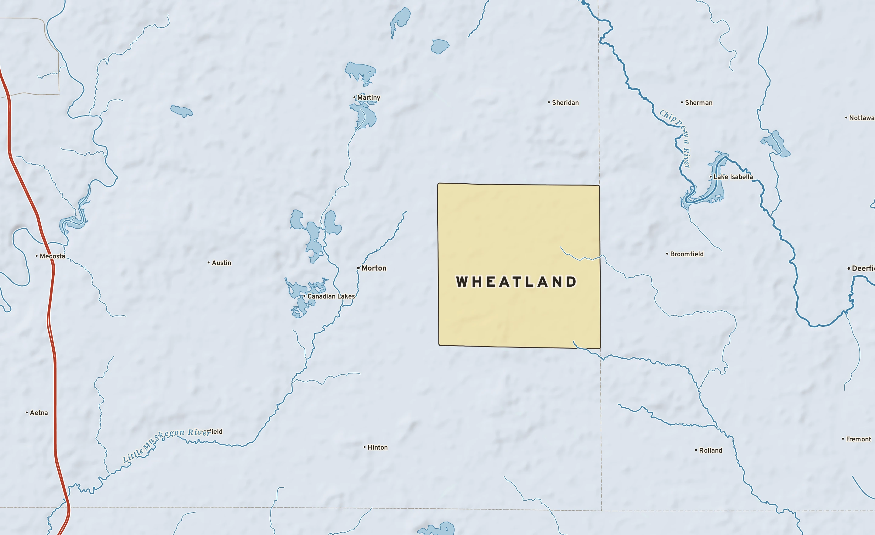 Shaded-relief atlas plate of Wheatland, Michigan: rivers, roads, the city limits and where the water drains.