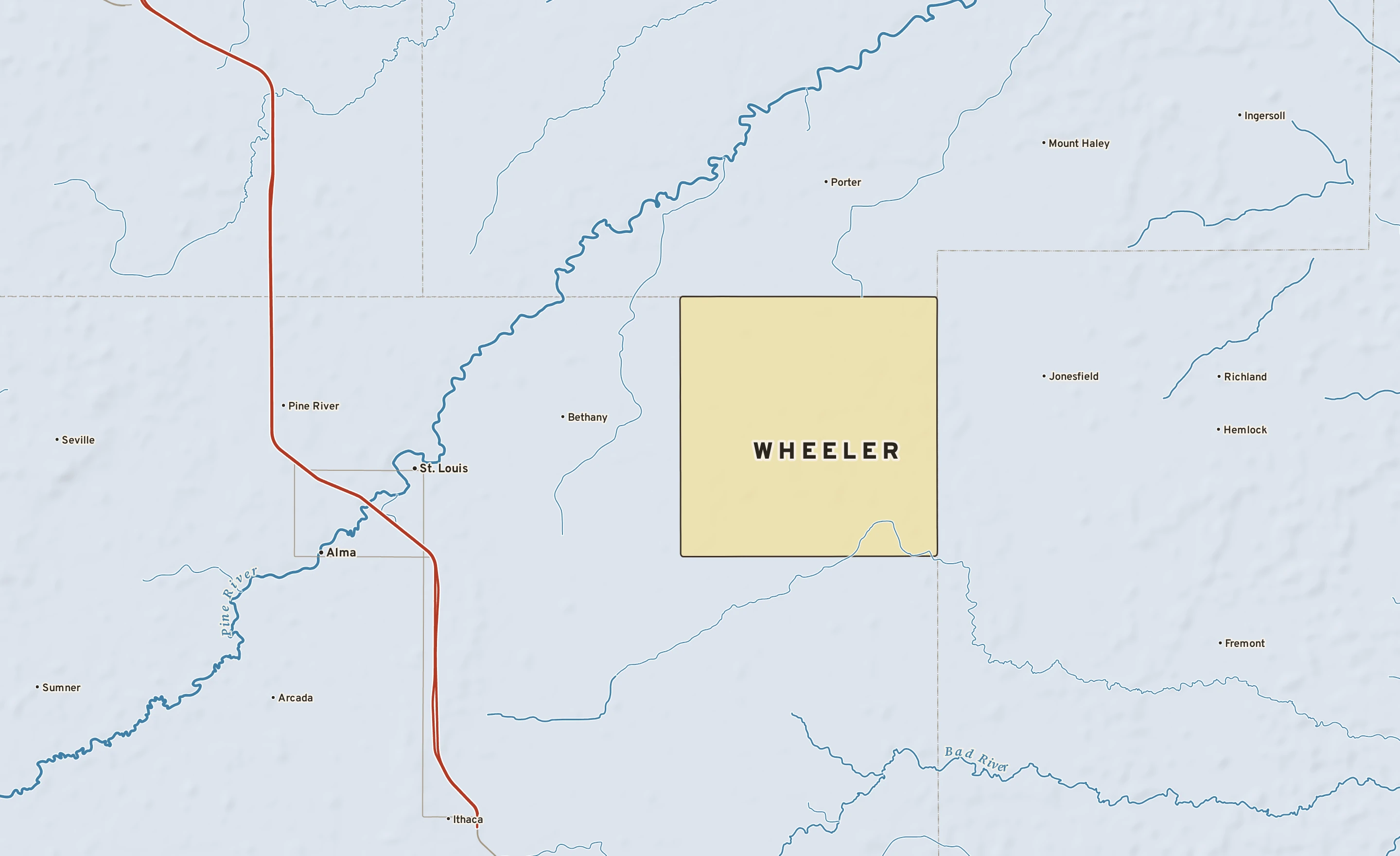 Shaded-relief atlas plate of Wheeler, Michigan: rivers, roads, the city limits and where the water drains.